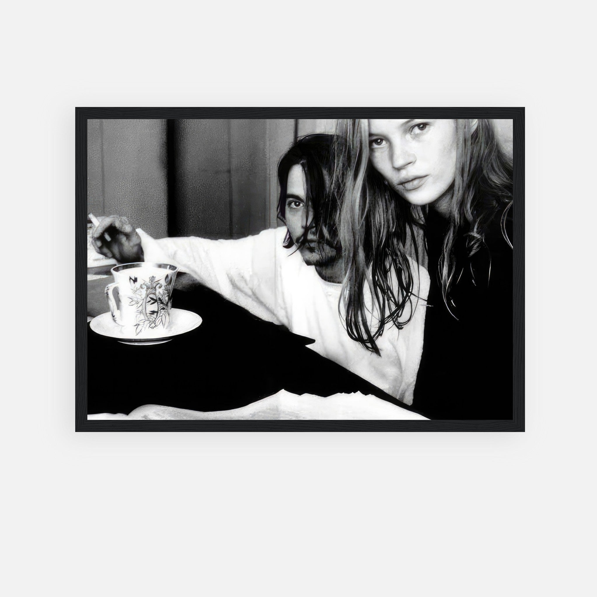 Black-and-white framed print of Johnny Depp and Kate Moss, capturing 1990s romance and intensity.