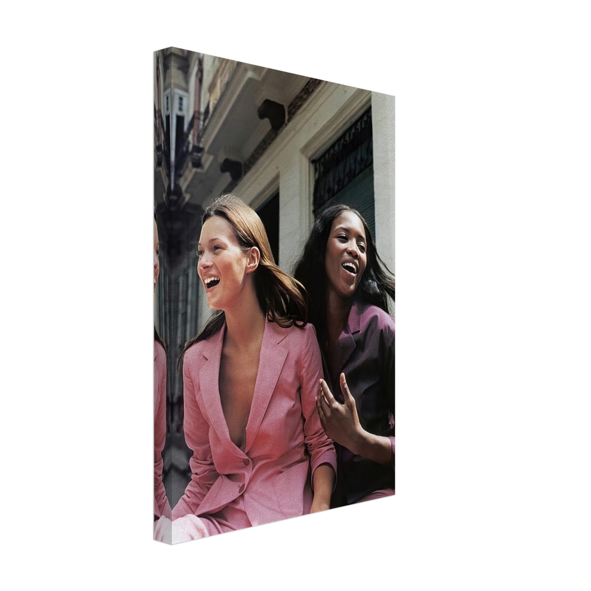 Naomi Campbell and Kate Moss laughing in stylish pink outfits, captured in a vibrant canvas print.