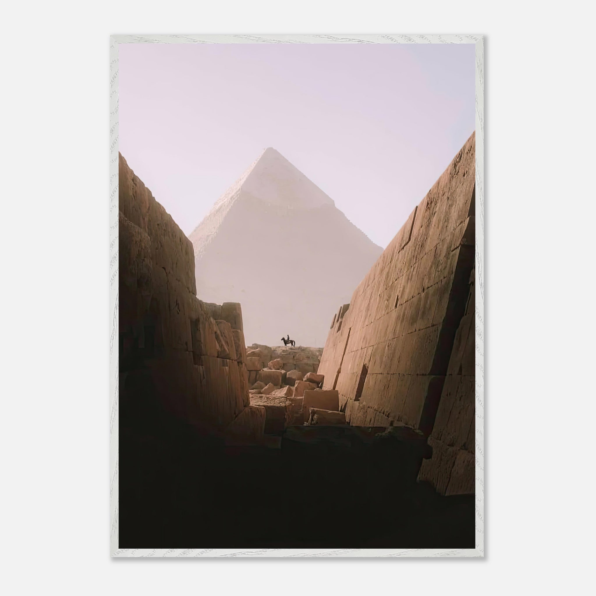 Lone rider on horseback in front of the Great Pyramid of Giza, capturing the grandeur of Egyptian history.