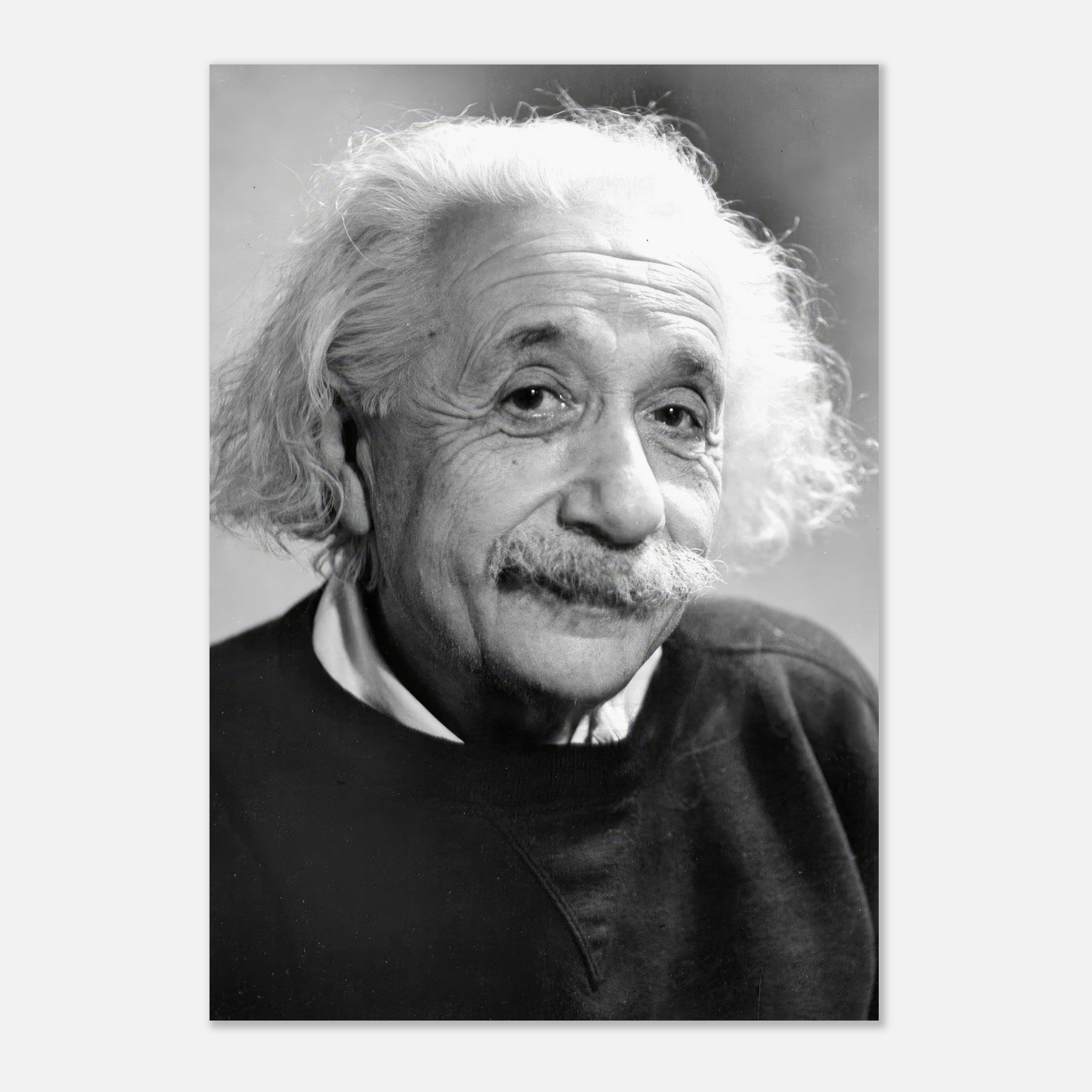 Black-and-white poster of Albert Einstein, capturing his thoughtful expression and iconic wild hair from 1946.