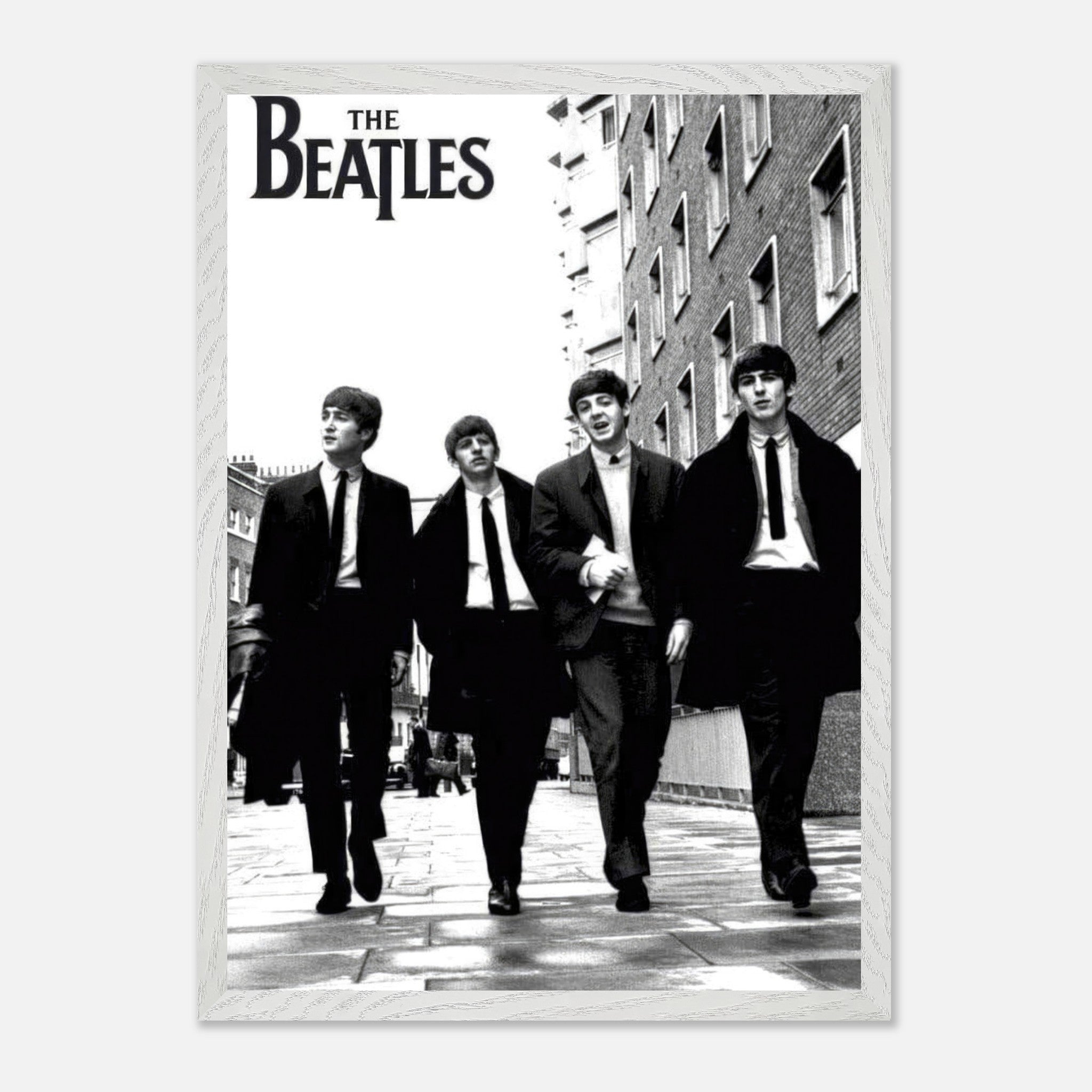 Vintage framed print of The Beatles walking together in black and white.