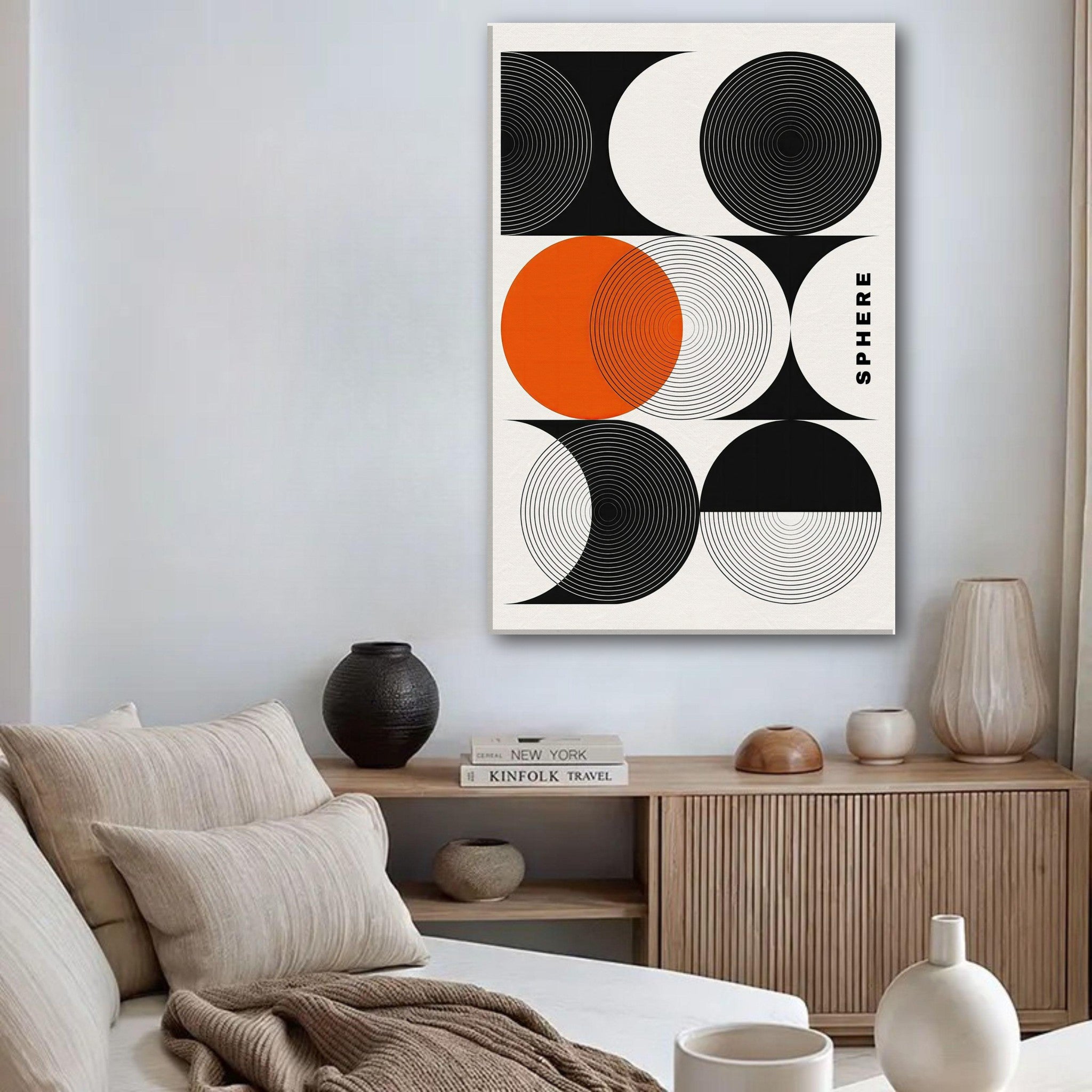 Abstract Geometric Sphere Canvas Print in modern living room featuring black, white, and orange patterns.