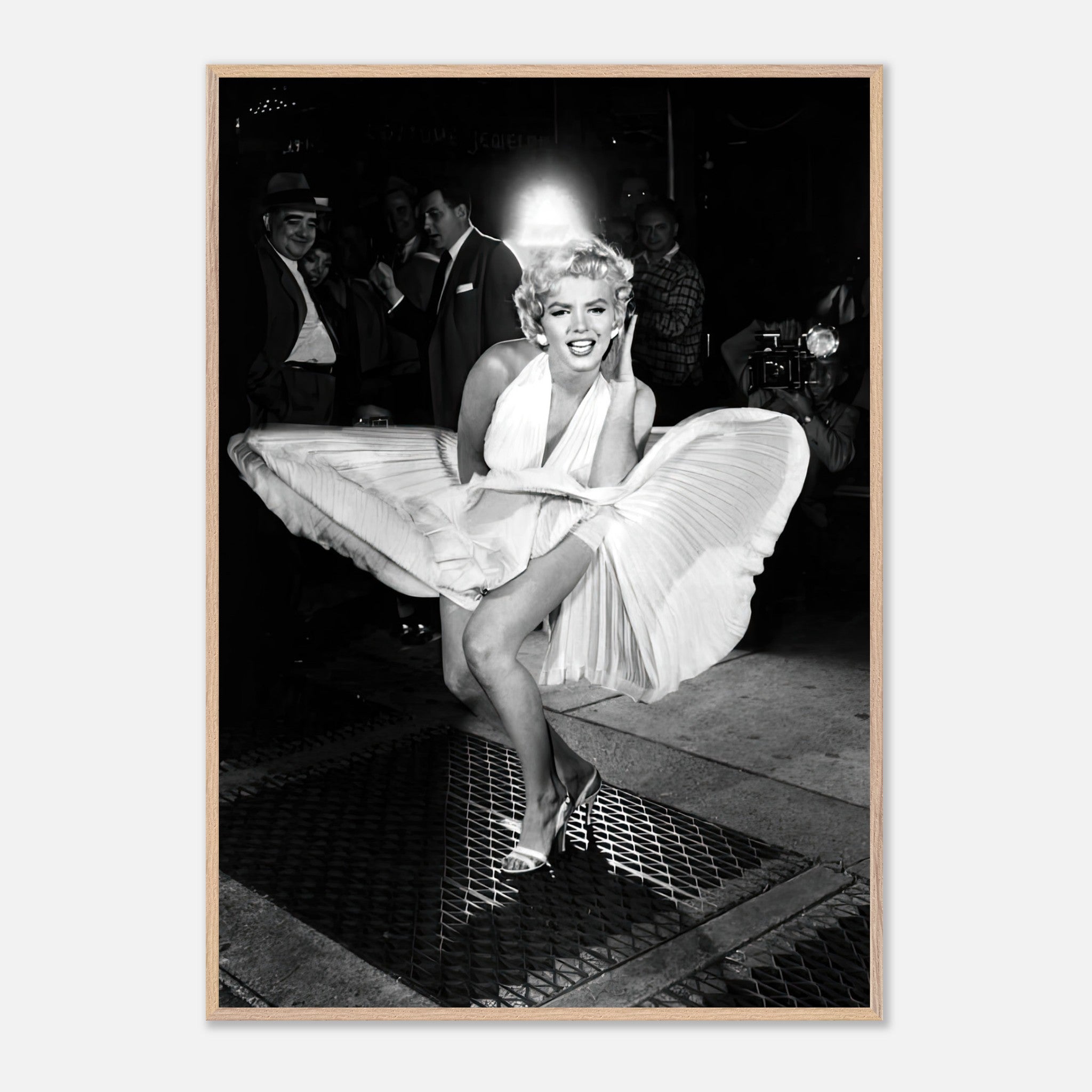 Marilyn Monroe in white dress, playfully caught by a gust of wind, showcasing Hollywood glamour and charm.