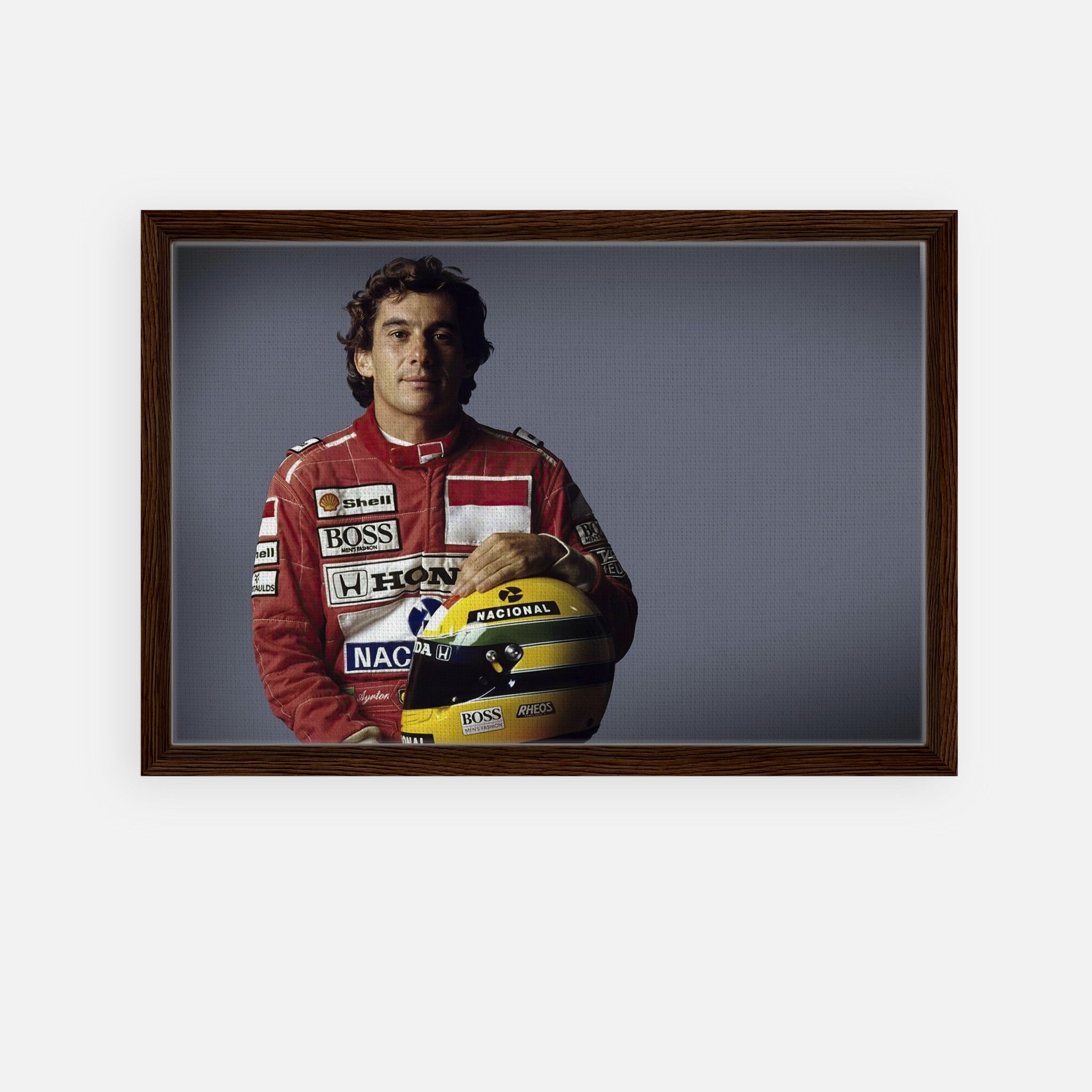 Ayrton Senna framed canvas print showcasing the legendary driver in his racing suit with a helmet.