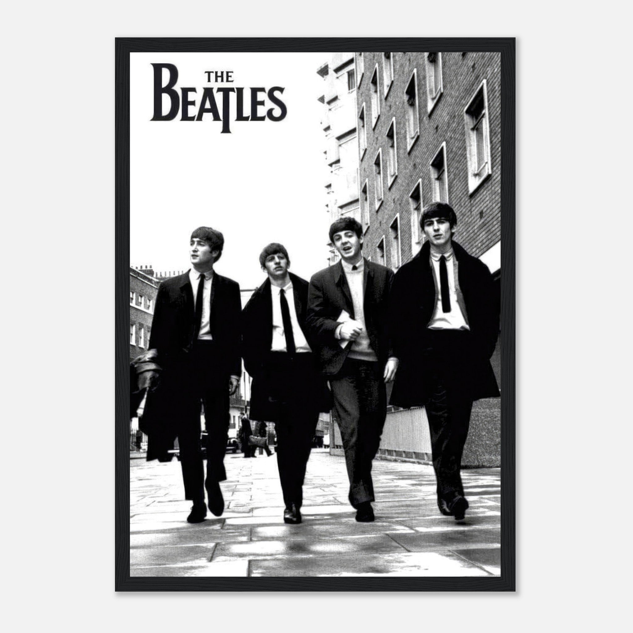 The Beatles black and white framed print featuring the iconic band walking together in suits.