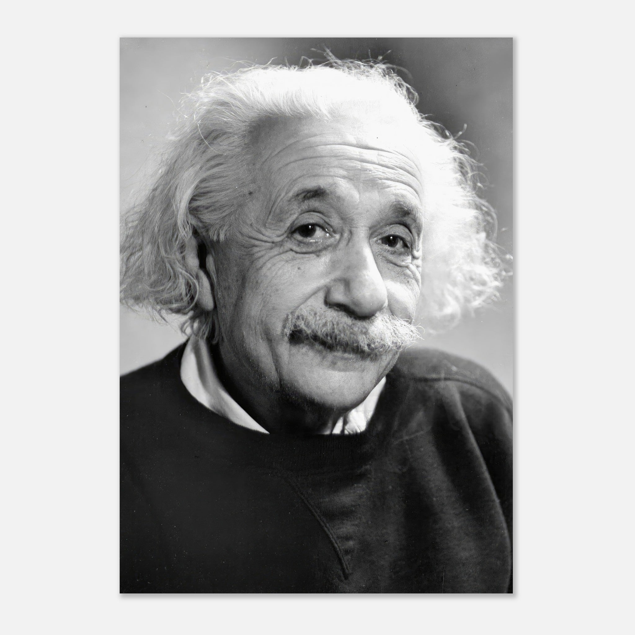 Black-and-white poster of Albert Einstein from 1946, showcasing his iconic wild hair and thoughtful expression.