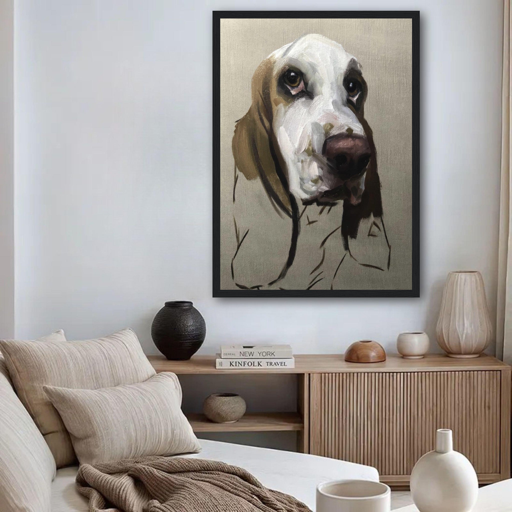 Framed print of a Basset Hound dog painting showcasing its soulful expression and droopy ears in a cozy living room.
