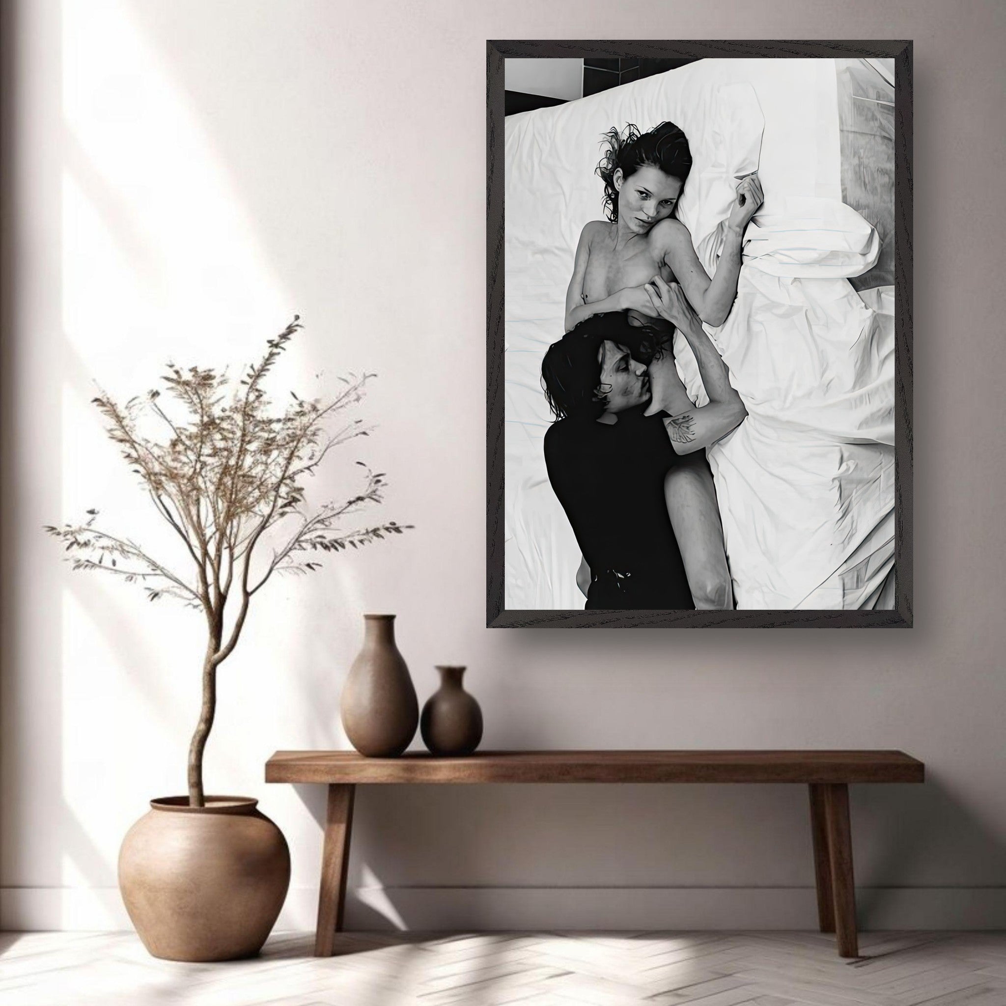 Black and white fine art print of intimate moment featuring a couple in a stylish interior setting.