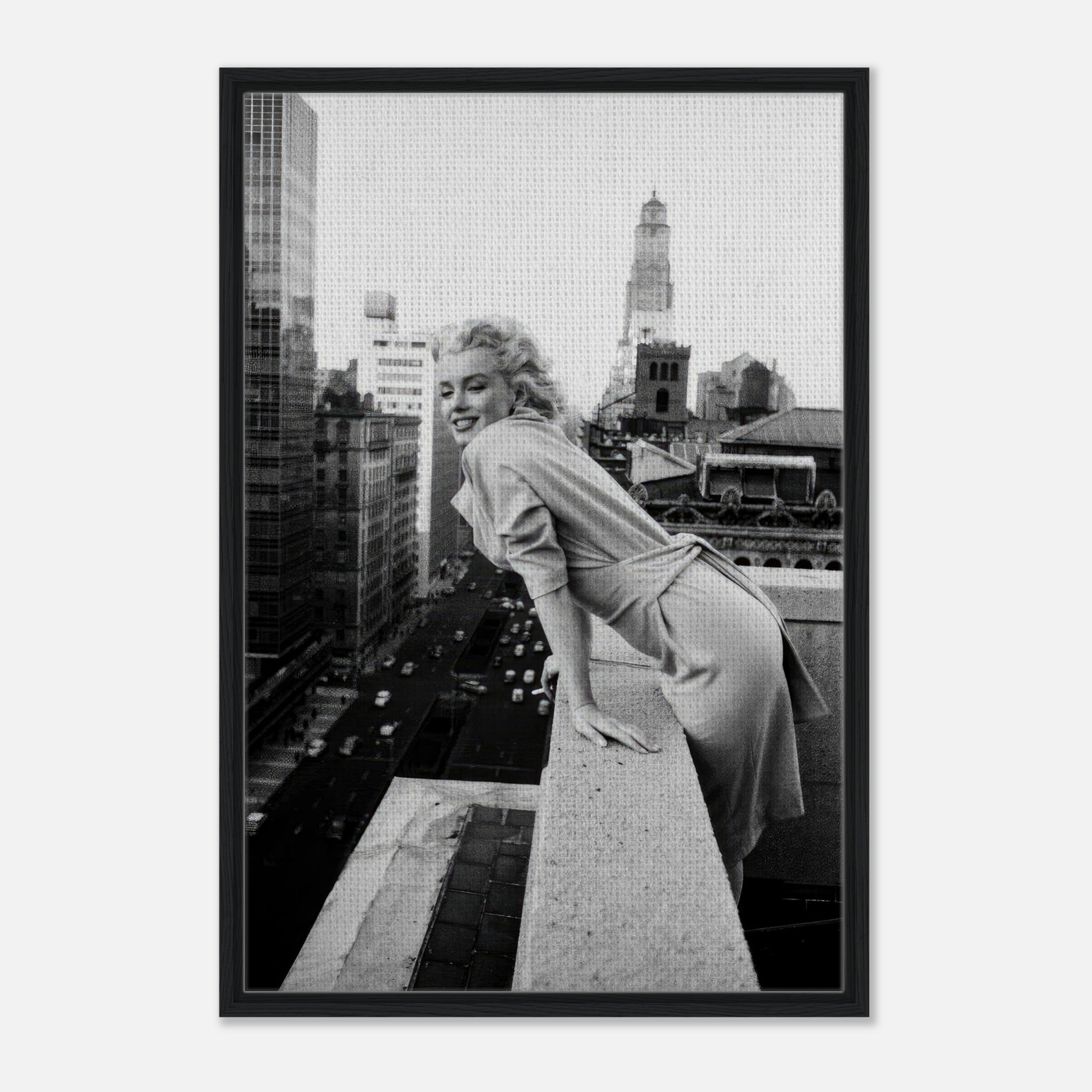 Marilyn Monroe smiling on a rooftop overlooking New York City, captured in a classic black-and-white framed canvas.