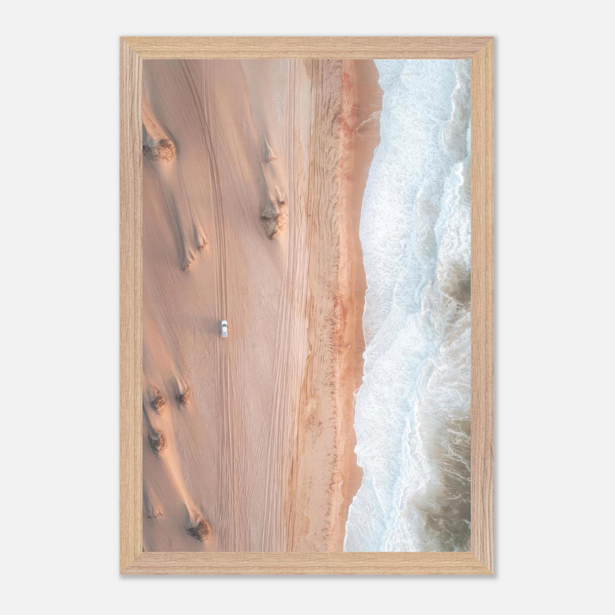 Aerial drone photography of desert dunes meeting the ocean waves, showcasing fine art landscapes.