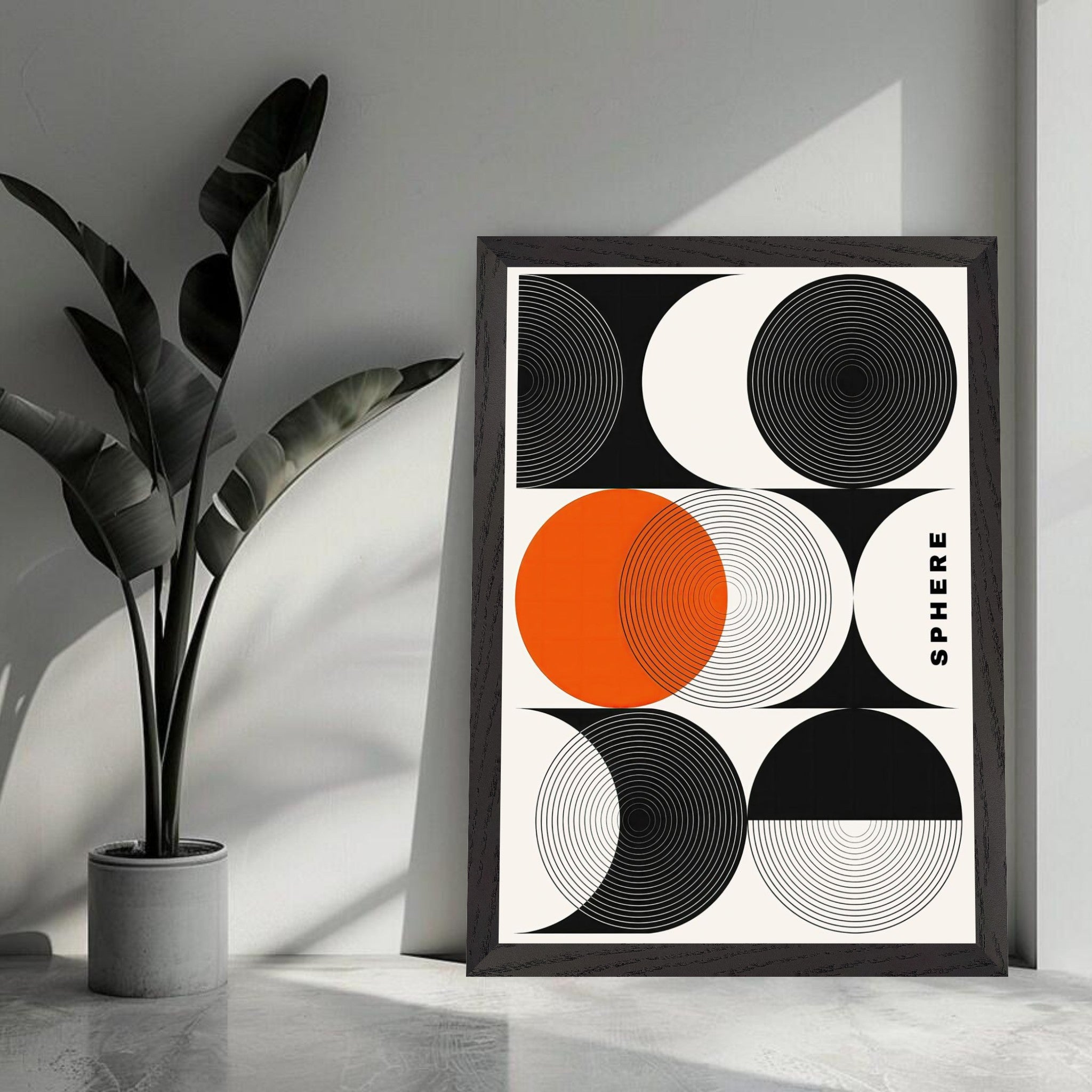 Abstract Geometric Sphere Art framed print with black, white, and orange circles in a modern decor setting.
