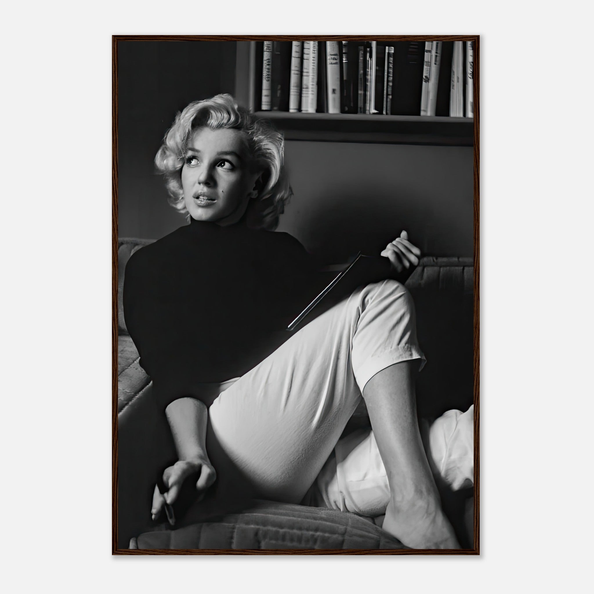 Marilyn Monroe reading a book in black-and-white framed print, adding vintage elegance to any space.
