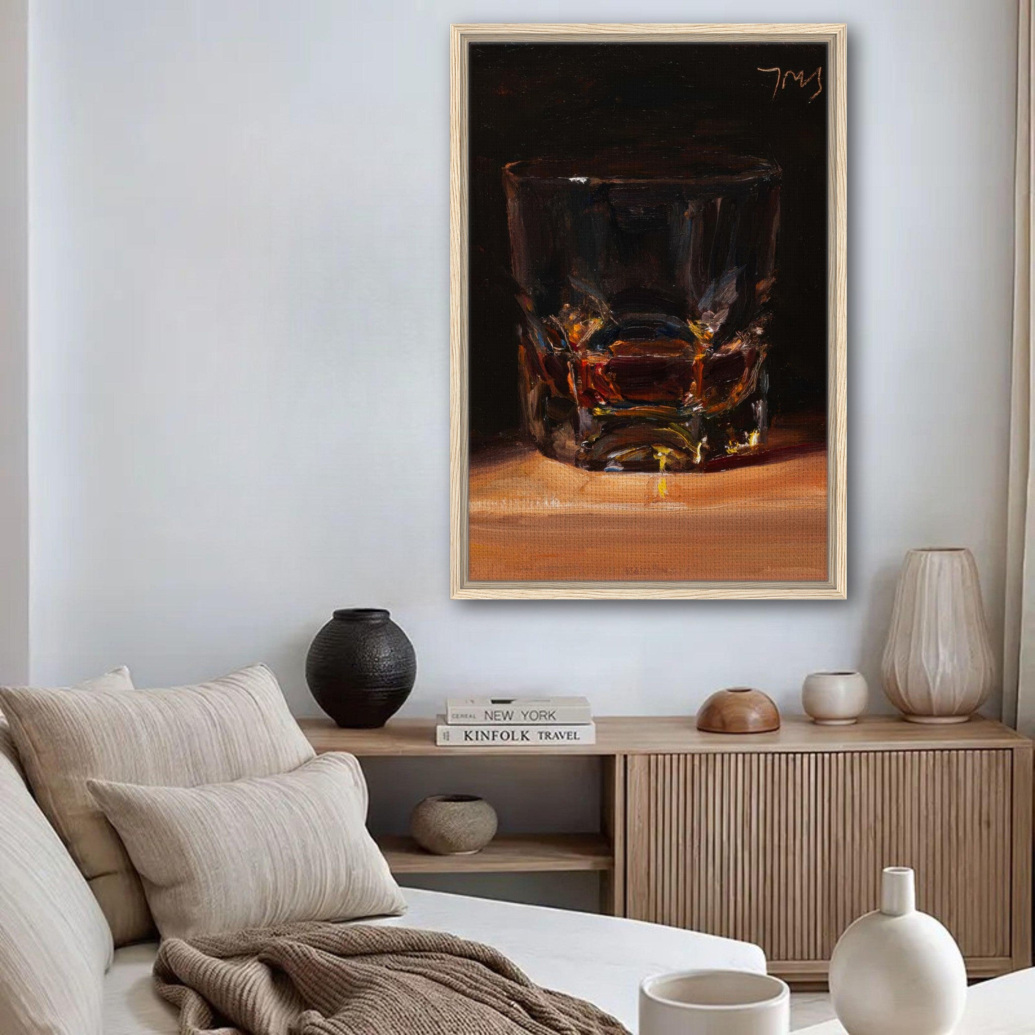 Whiskey framed canvas print in a modern living room showcasing a glass of whiskey with stylish decor.