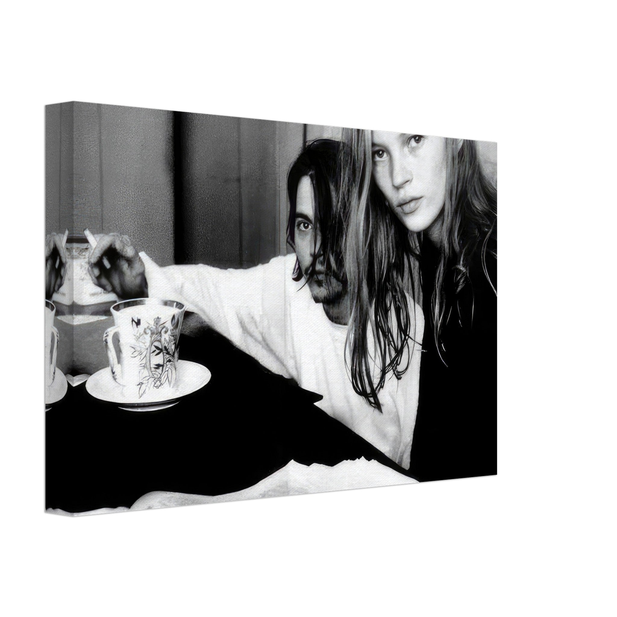 Black-and-white canvas print of Johnny Depp and Kate Moss enjoying tea, capturing 90s nostalgia and rebellious romance.