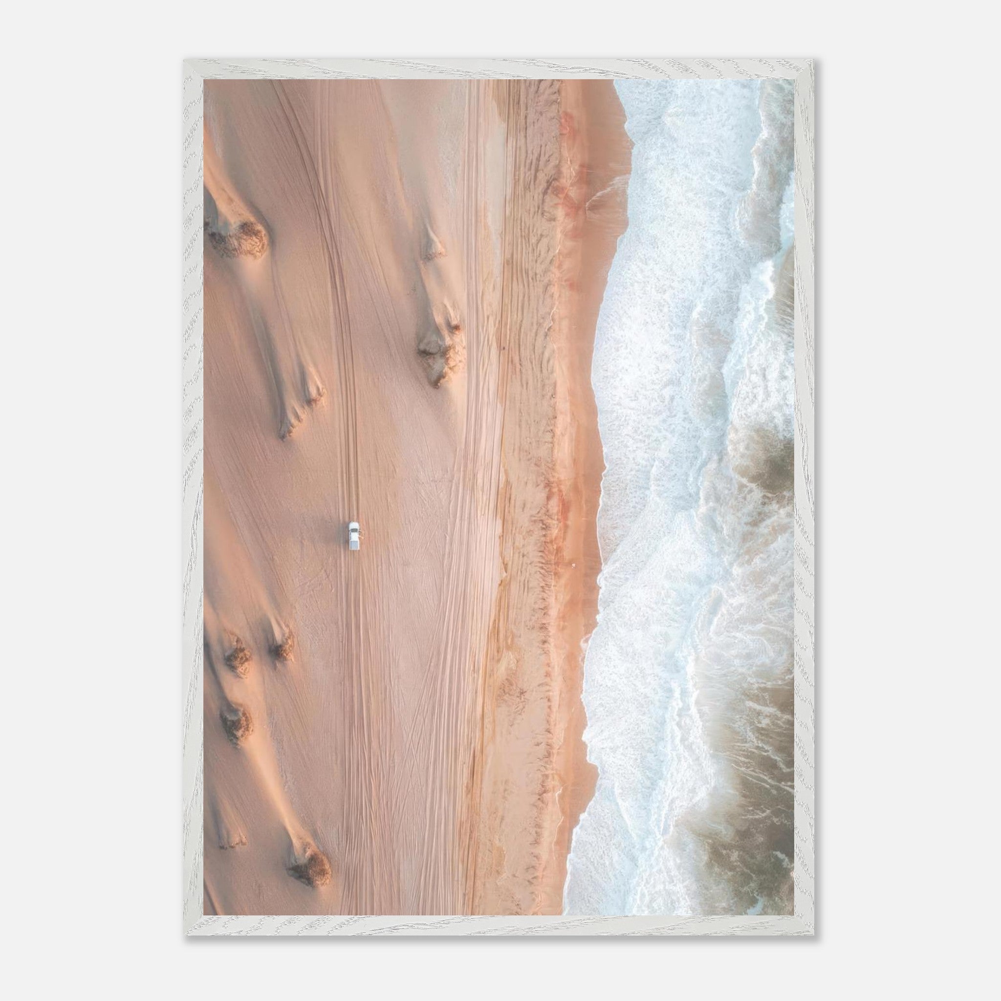 Drone photography of golden desert dunes meeting ocean waves in a vintage framed print.