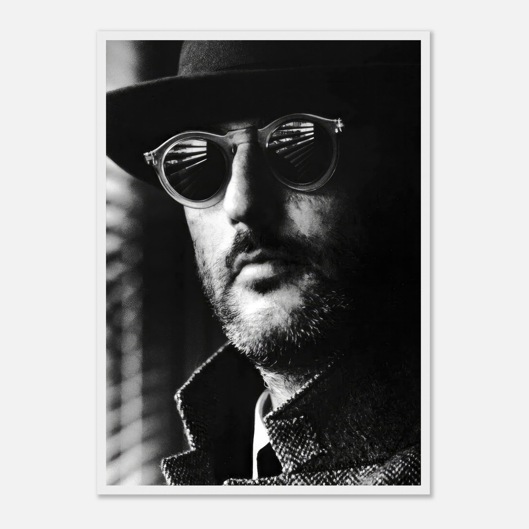 Jean Reno Leon Photography framed print, black-and-white portrait with stylish sunglasses, showcasing cinematic charm.