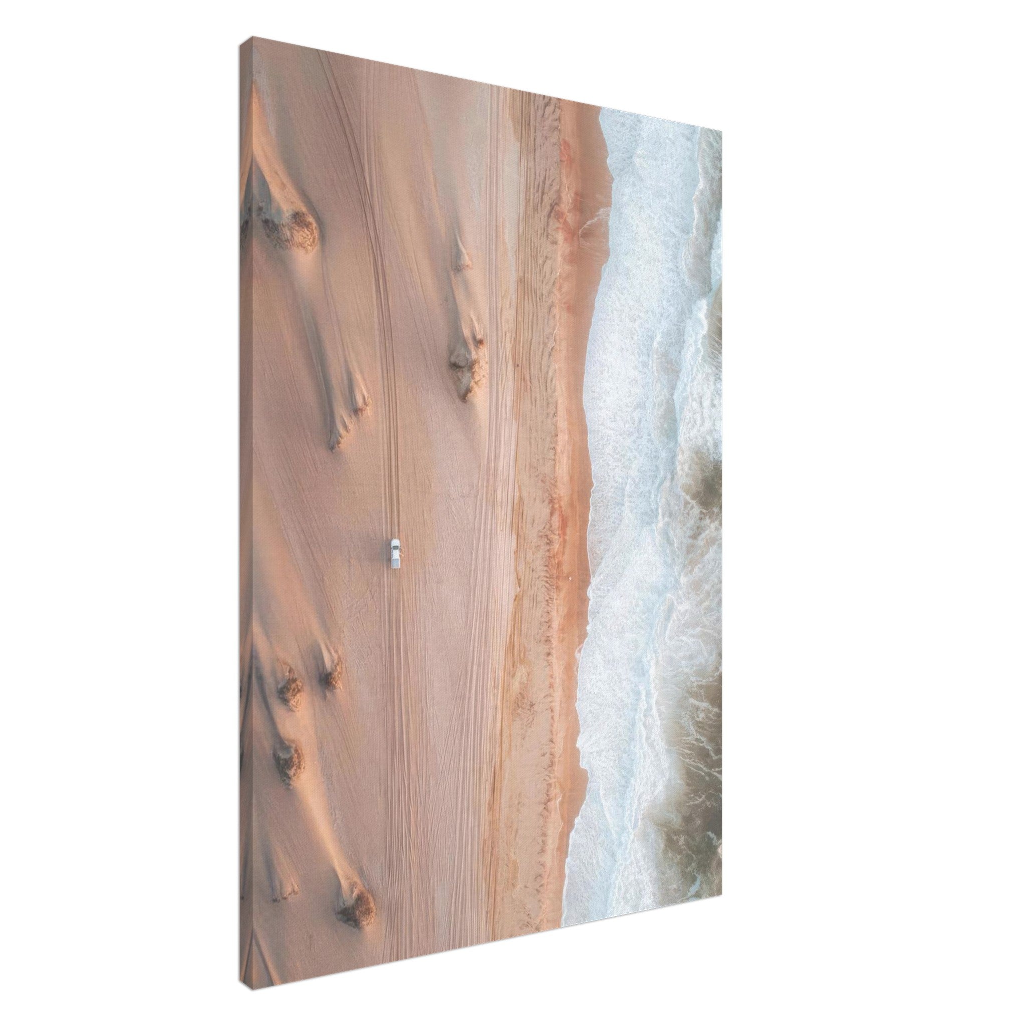 Aerial view of desert sand dunes meeting ocean waves in a stunning drone photography canvas print.