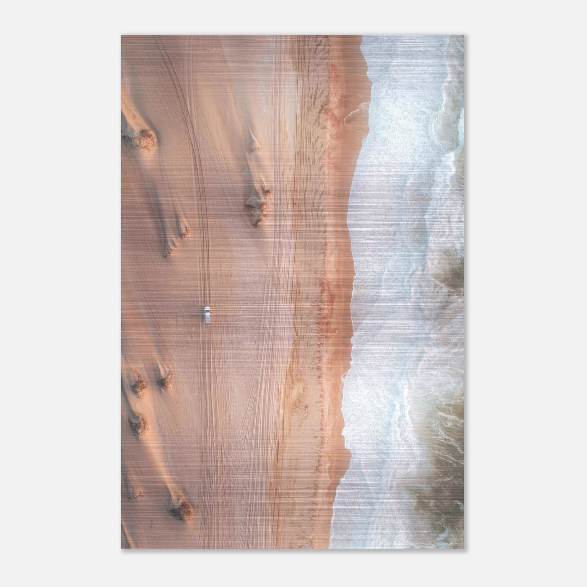 Drone photo of desert meeting ocean, showcasing sandy dunes and crashing waves on brushed metal print.