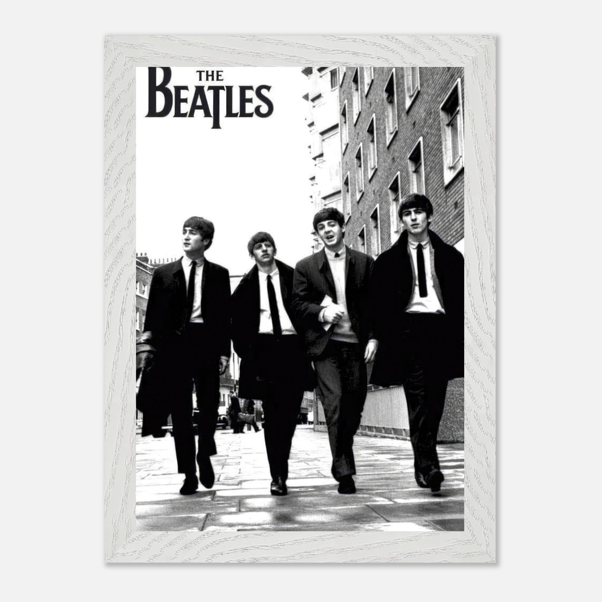 The Beatles vintage framed print depicting the iconic band walking in black and white, perfect for music lovers.