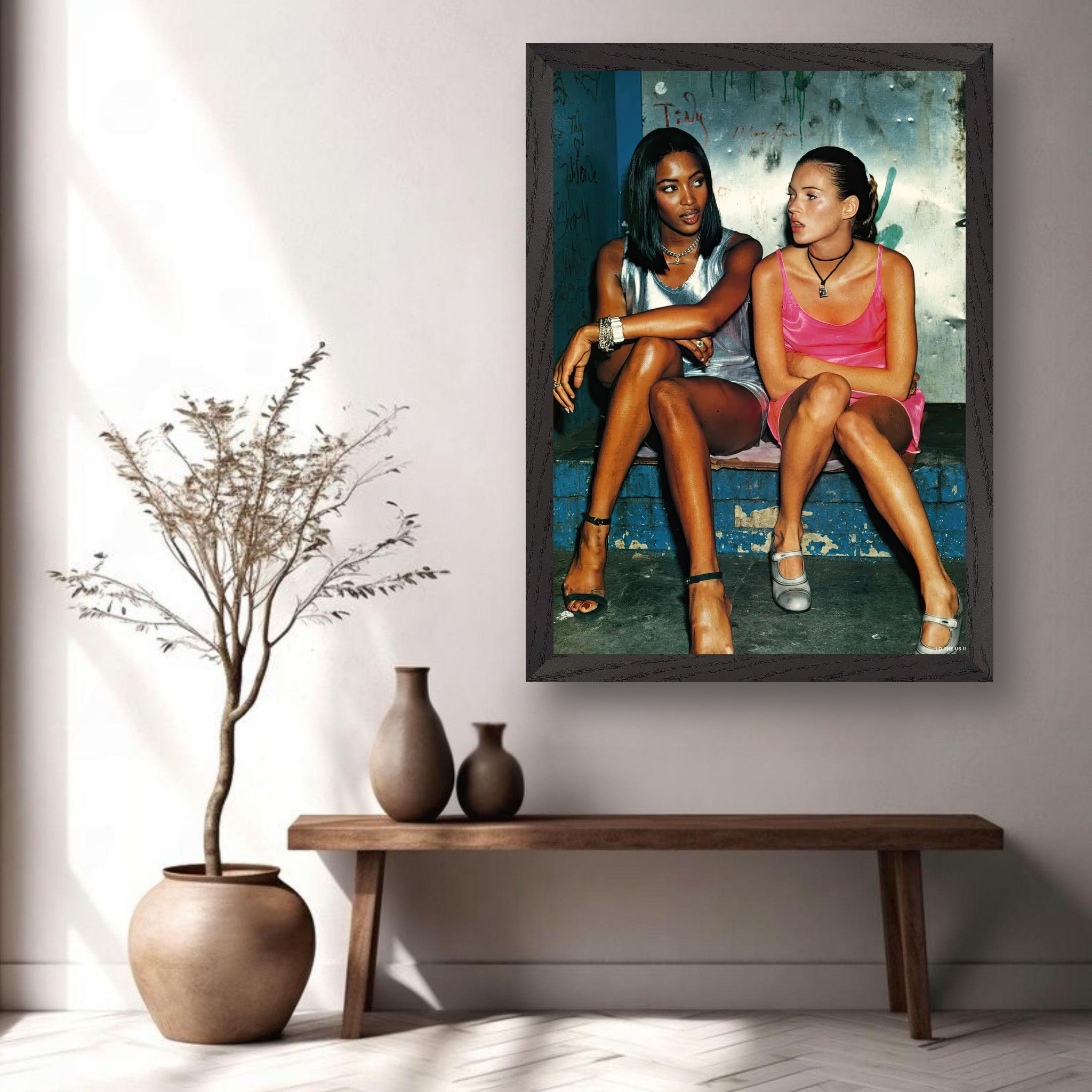 Naomi Campbell and Kate Moss vintage framed print capturing 90s supermodel glamour in a stylish interior setting.