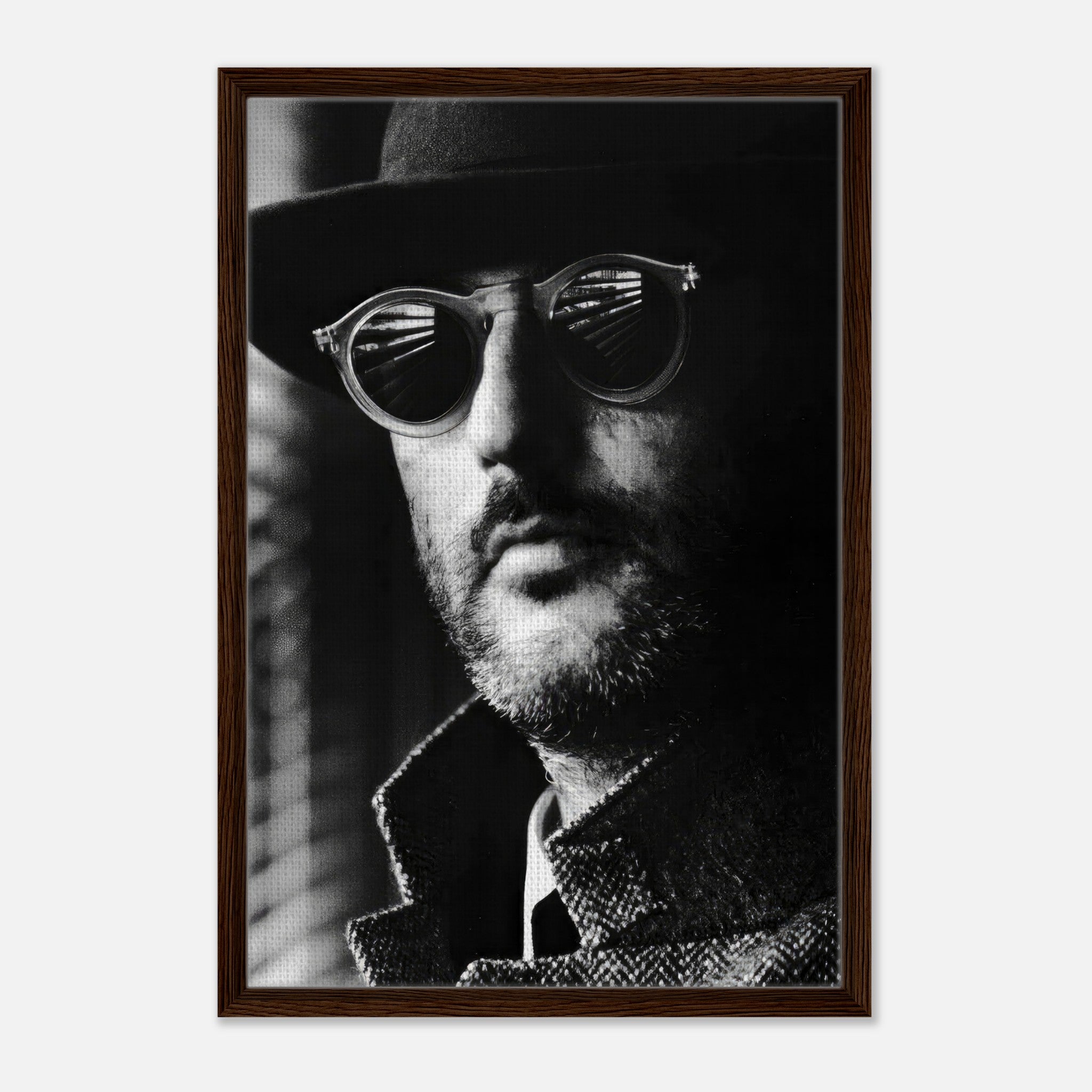 Framed canvas print of Jean Reno from Leon, showcasing a dramatic black-and-white portrait with sunglasses.
