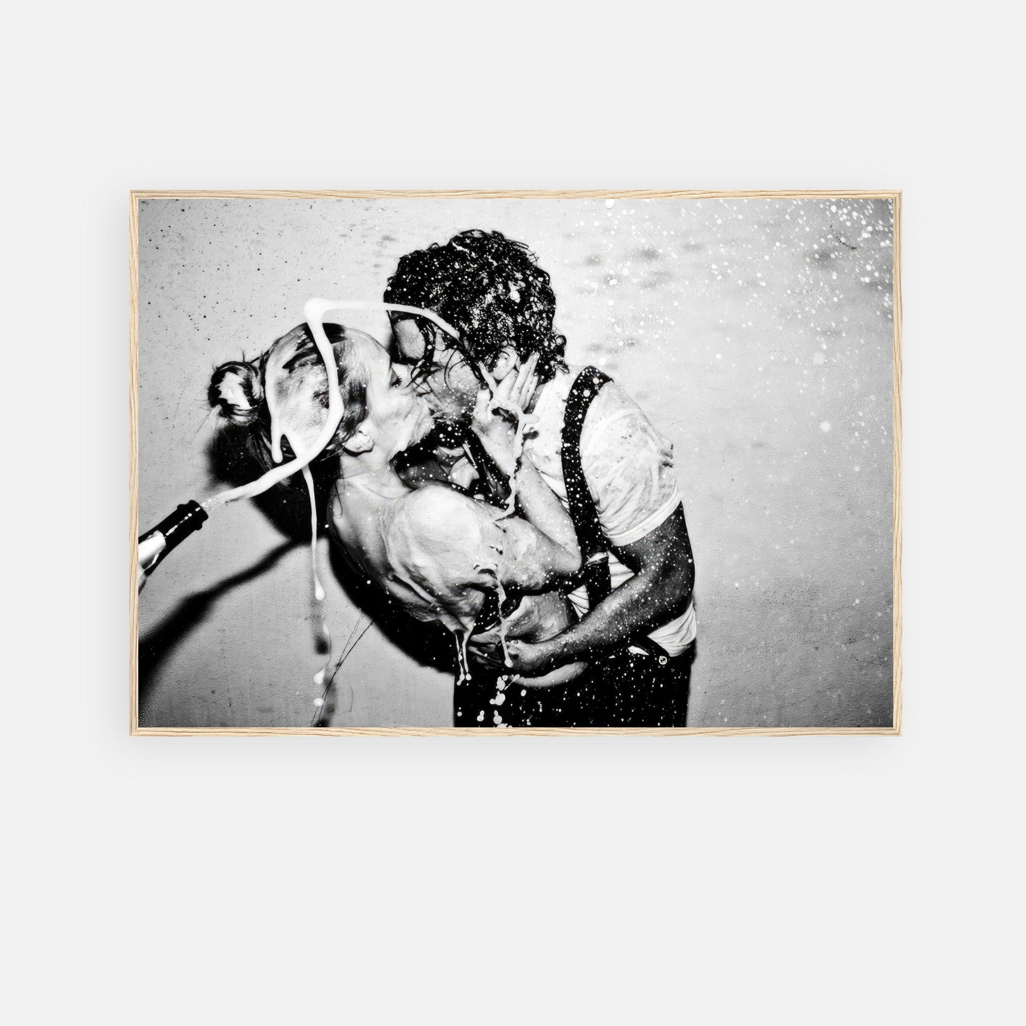 The Champagne Kiss framed print featuring Johnny Depp and Kate Moss in a passionate black-and-white photograph.