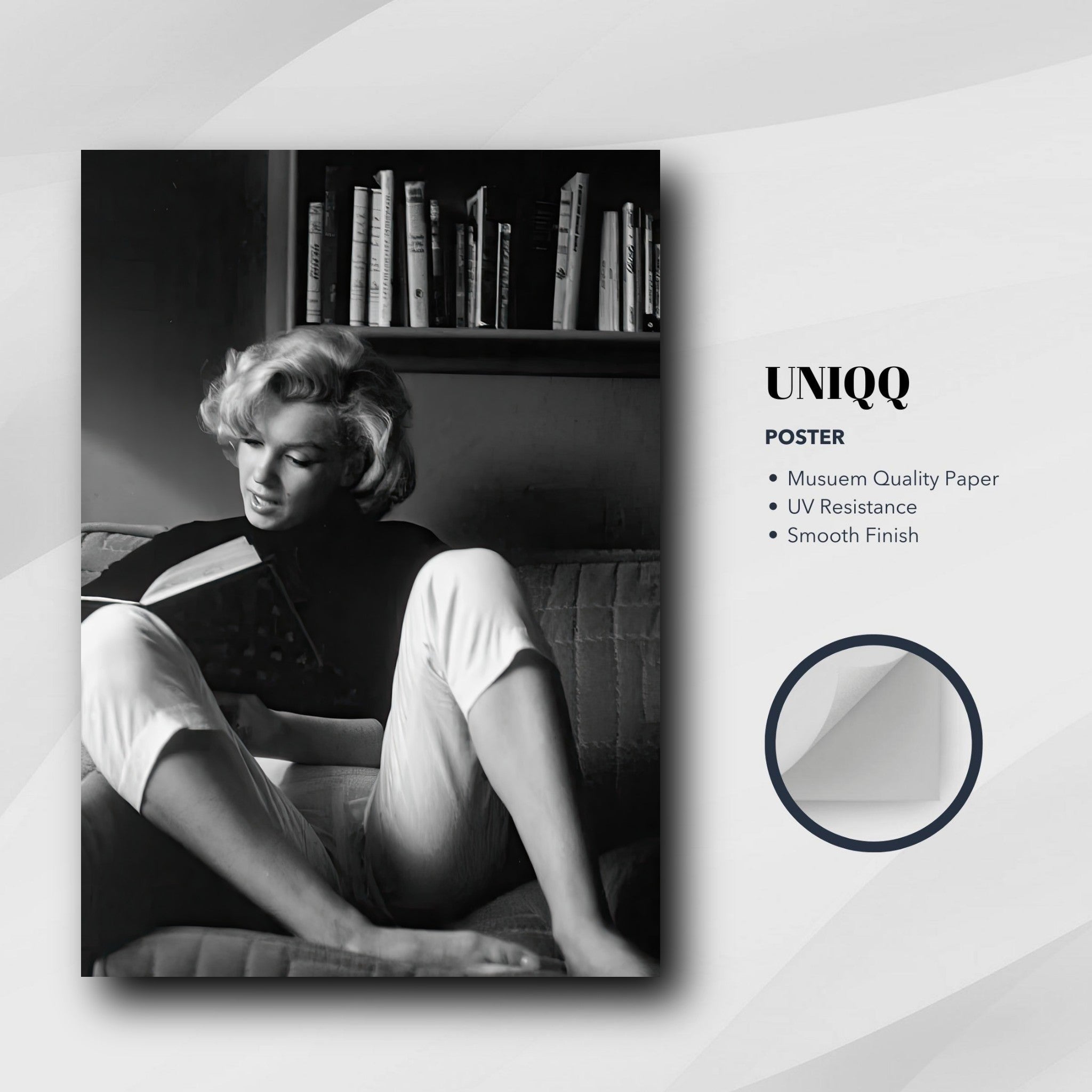 Black-and-white poster of Marilyn Monroe reading at home, showcasing vintage elegance and literary charm.