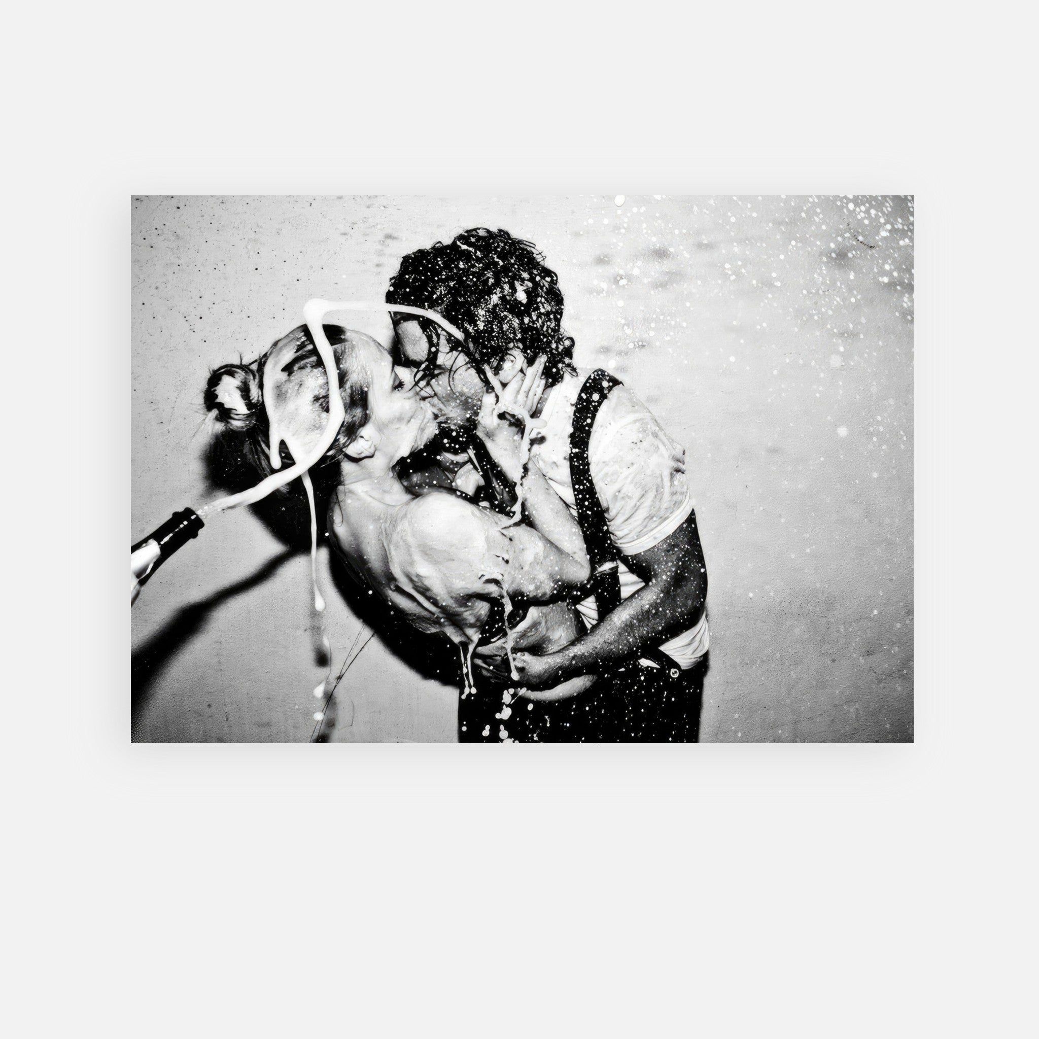 Black-and-white metal print of Johnny Depp and Kate Moss in an intimate champagne kiss by Tyler Shields.