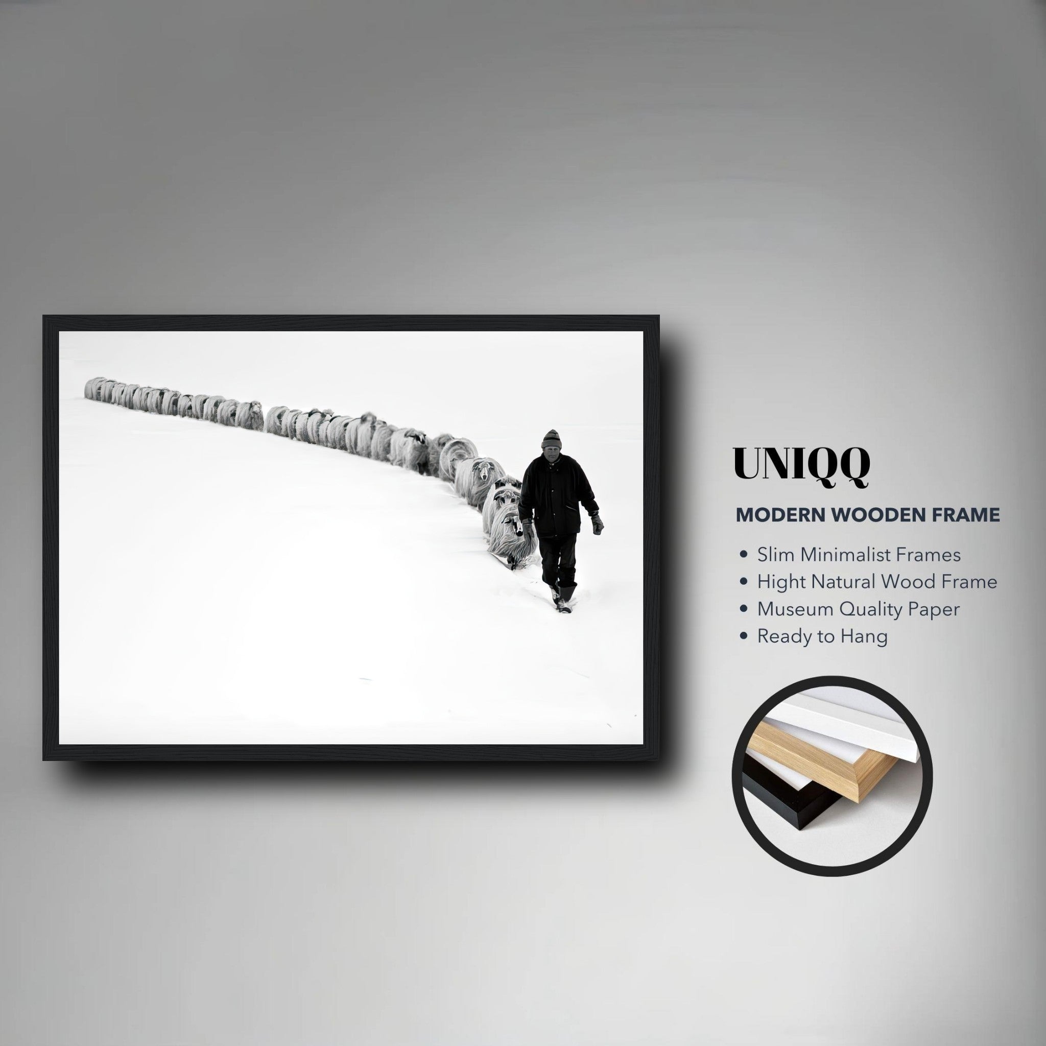 Framed black-and-white print of a shepherd guiding a flock through a snowy landscape, symbolizing resilience and unity.