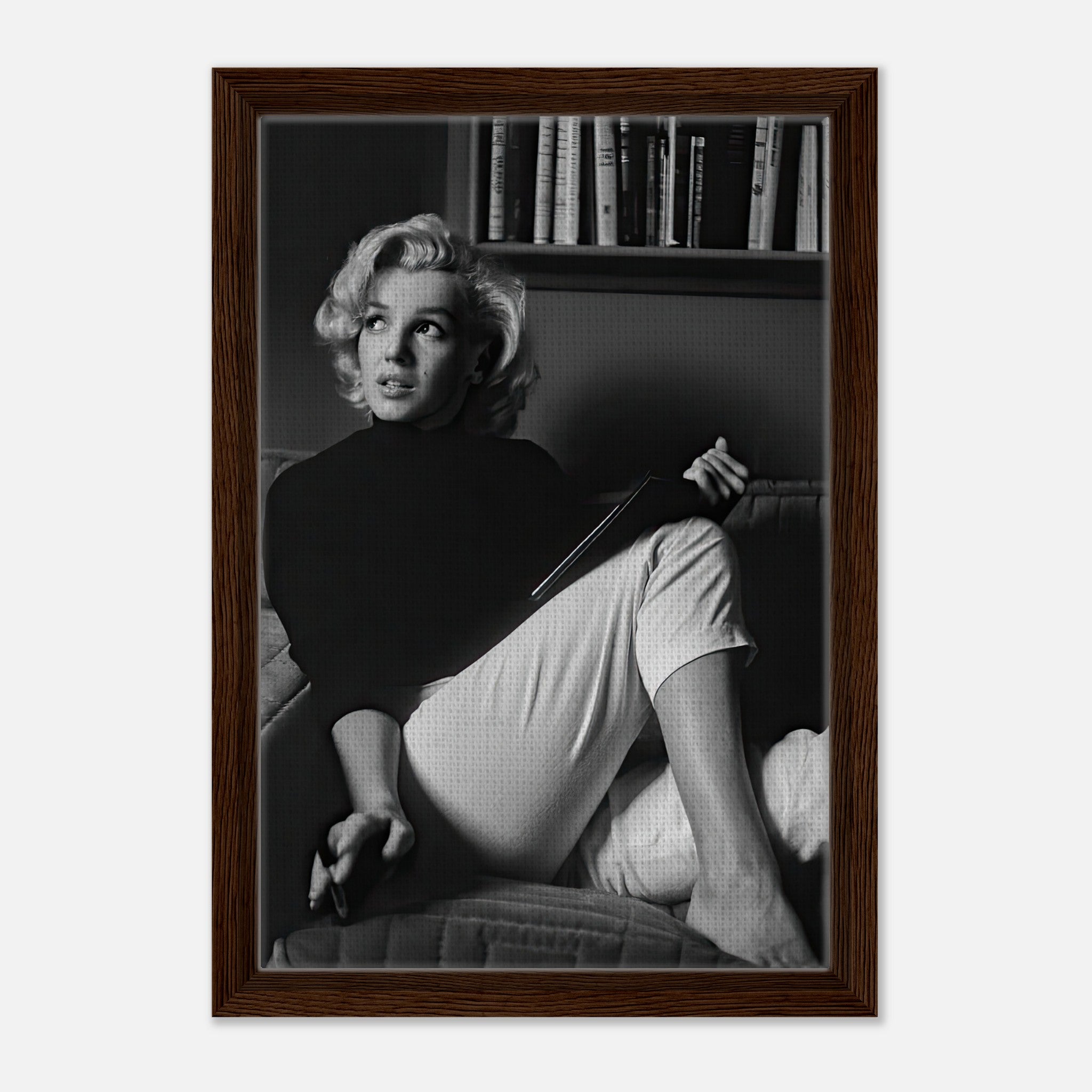 Marilyn Monroe Reading Book Framed Canvas Print in black-and-white, showcasing elegance and charm.