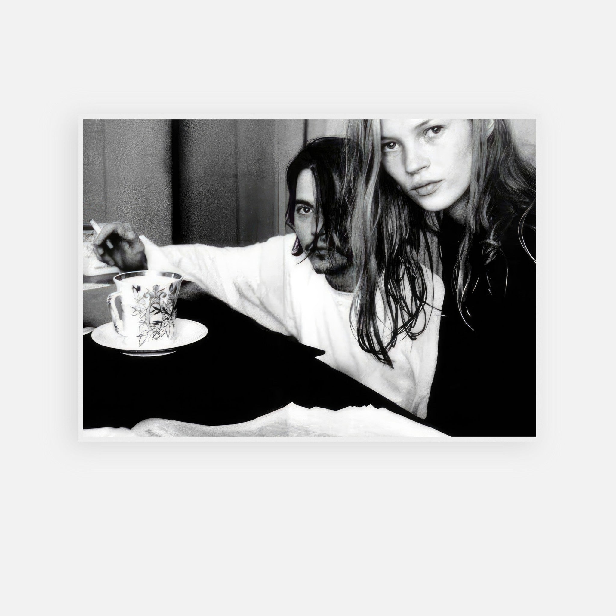 Black-and-white framed print of Johnny Depp and Kate Moss, capturing 1990s rebellious romance and artistic allure.