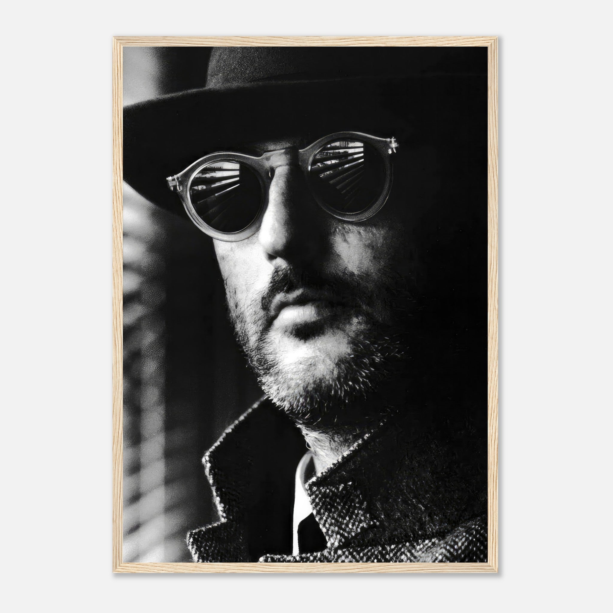 Framed black-and-white print of Jean Reno in sunglasses, showcasing cinematic elegance and enigmatic charm.