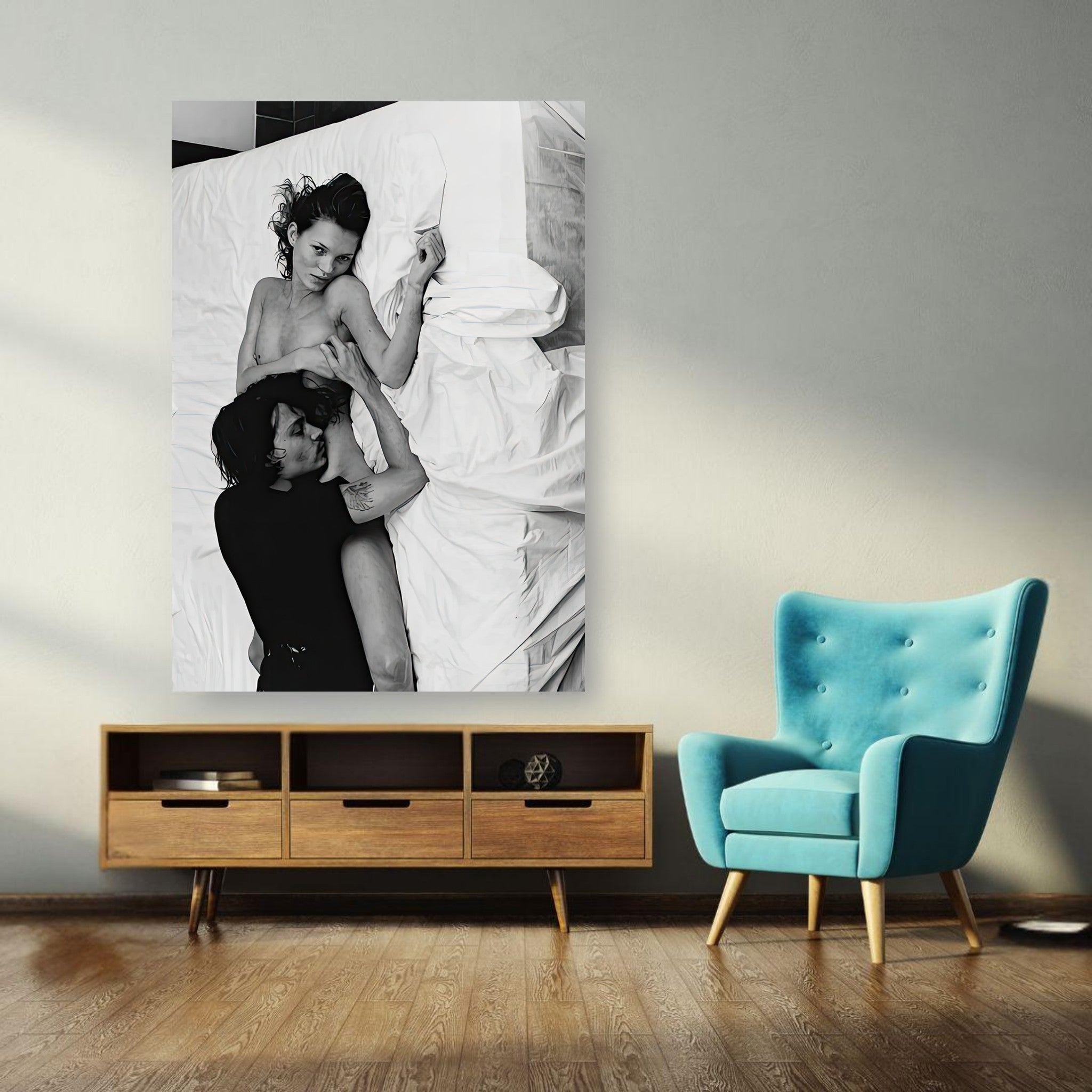 Black-and-white poster of Kate Moss and Johnny Depp from 1994, displayed on a wall in a stylish interior.