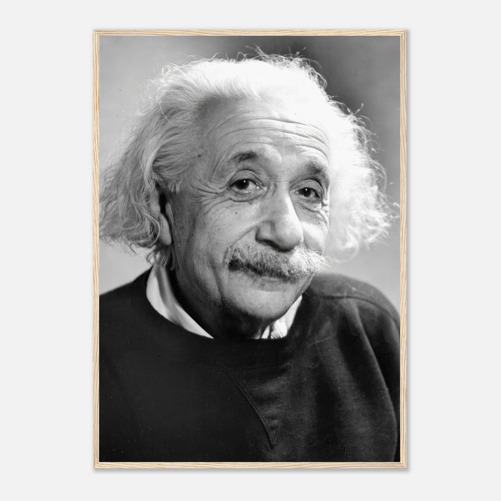 Framed 1946 black-and-white portrait of Albert Einstein, showcasing his intellectual charm and wisdom.