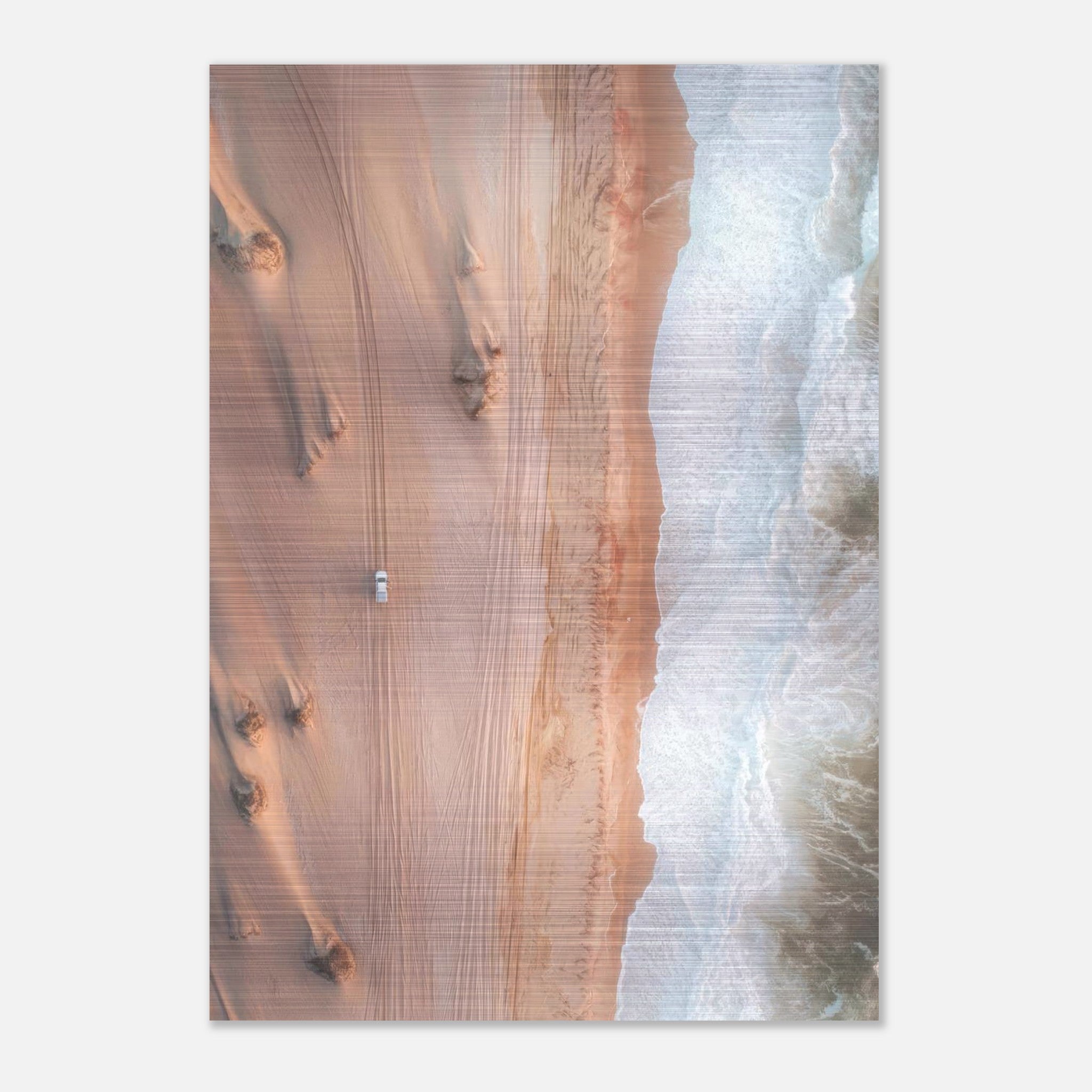 Drone photography of golden desert dunes meeting ocean waves on brushed metal print.