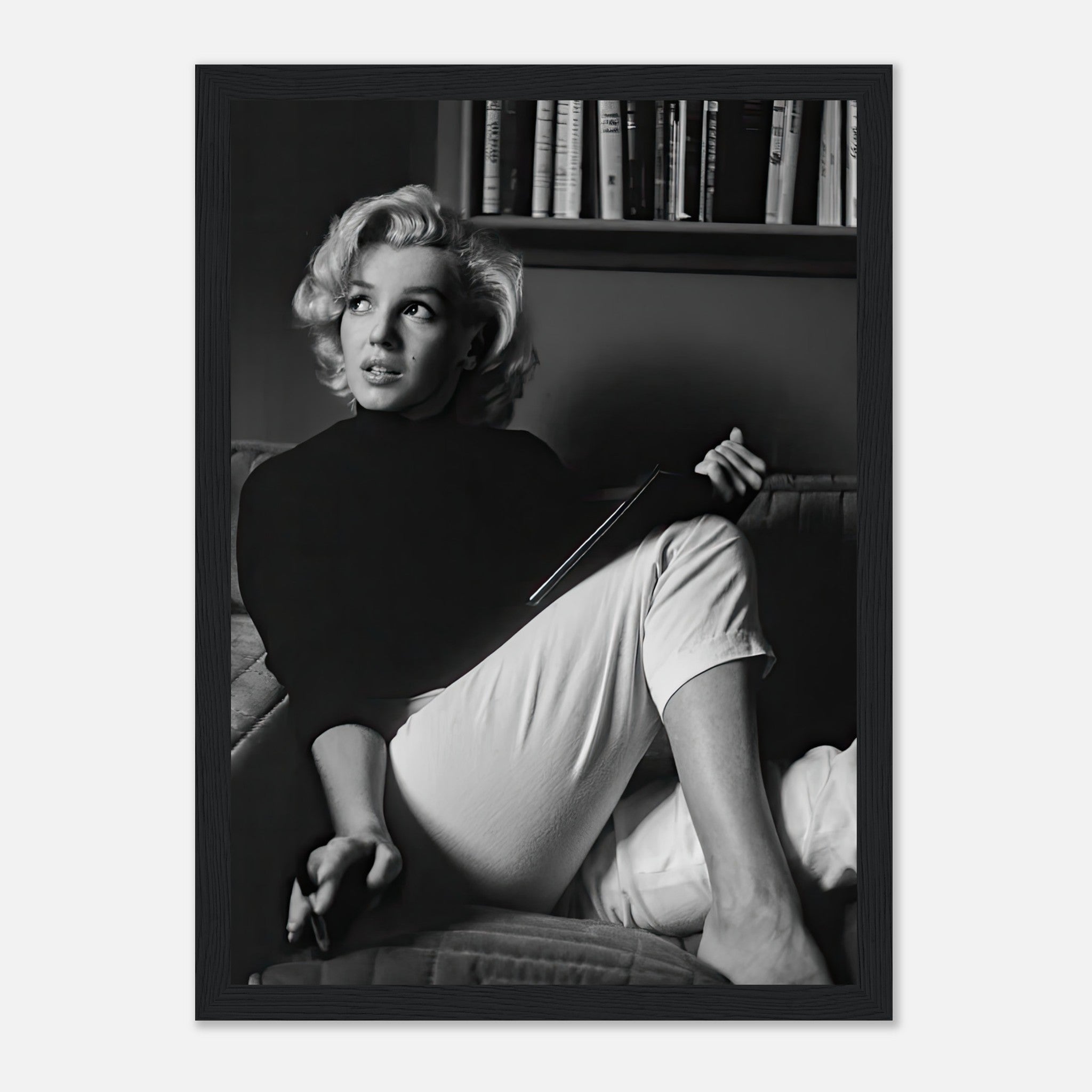 Marilyn Monroe framed print in black and white, showcasing her reading, adding vintage charm to any room.