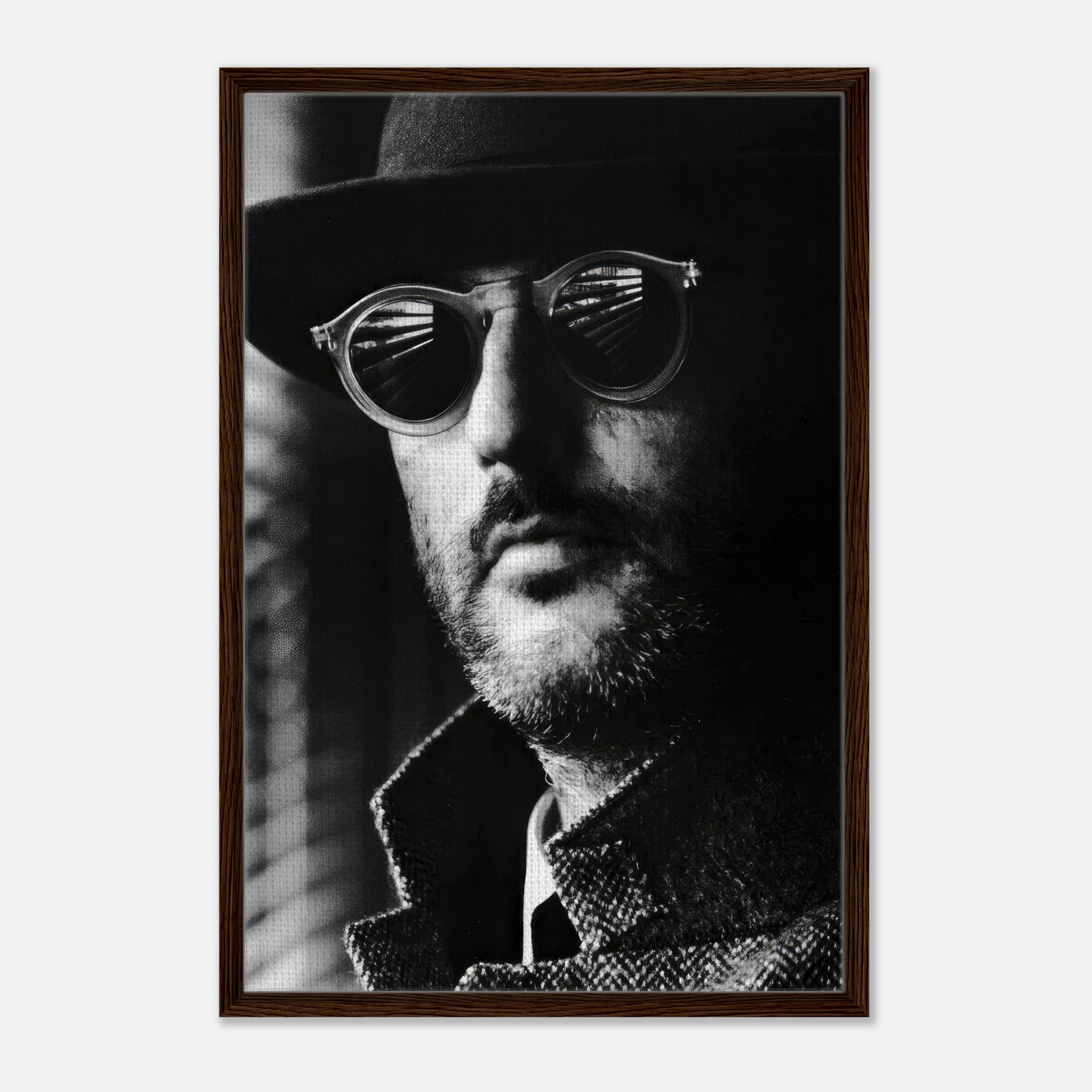 Jean Reno Leon Photography framed canvas print featuring a black-and-white portrait with sunglasses.