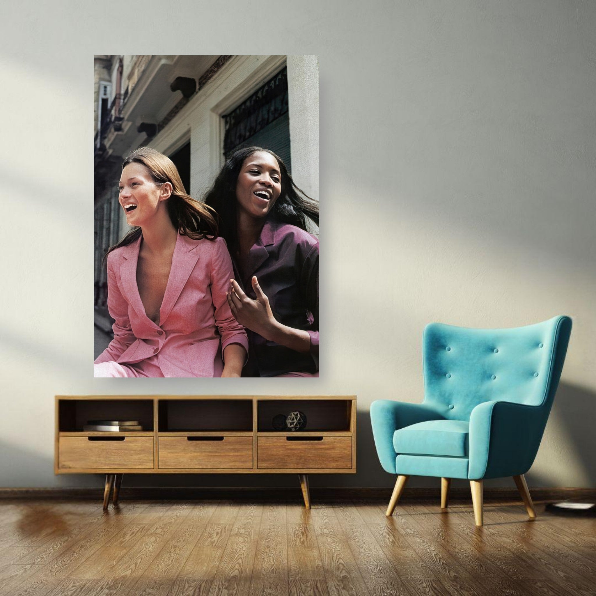 Naomi Campbell and Kate Moss poster showcasing iconic supermodels in a candid moment of joy and style.