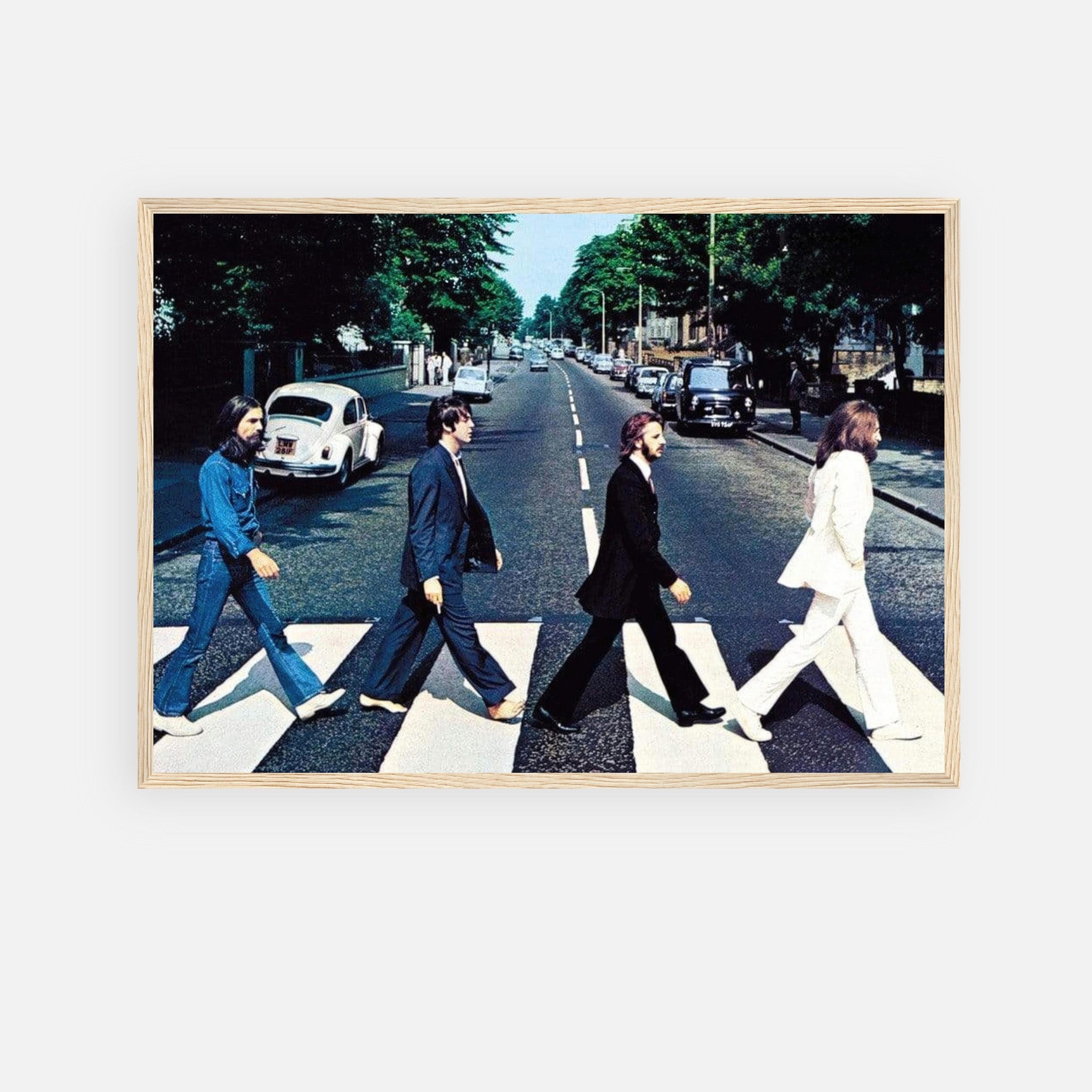 The Beatles Abbey Road framed print featuring iconic crossing scene with band members walking across a zebra crossing.