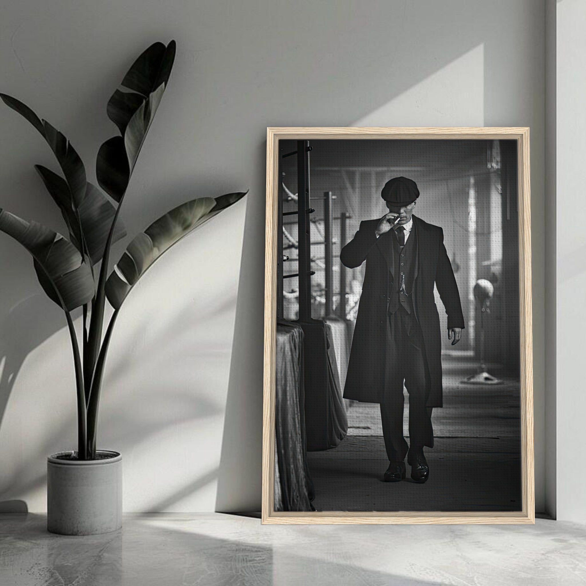 Tommy Shelby framed canvas print from Peaky Blinders, showcasing dramatic monochrome style in a modern interior.