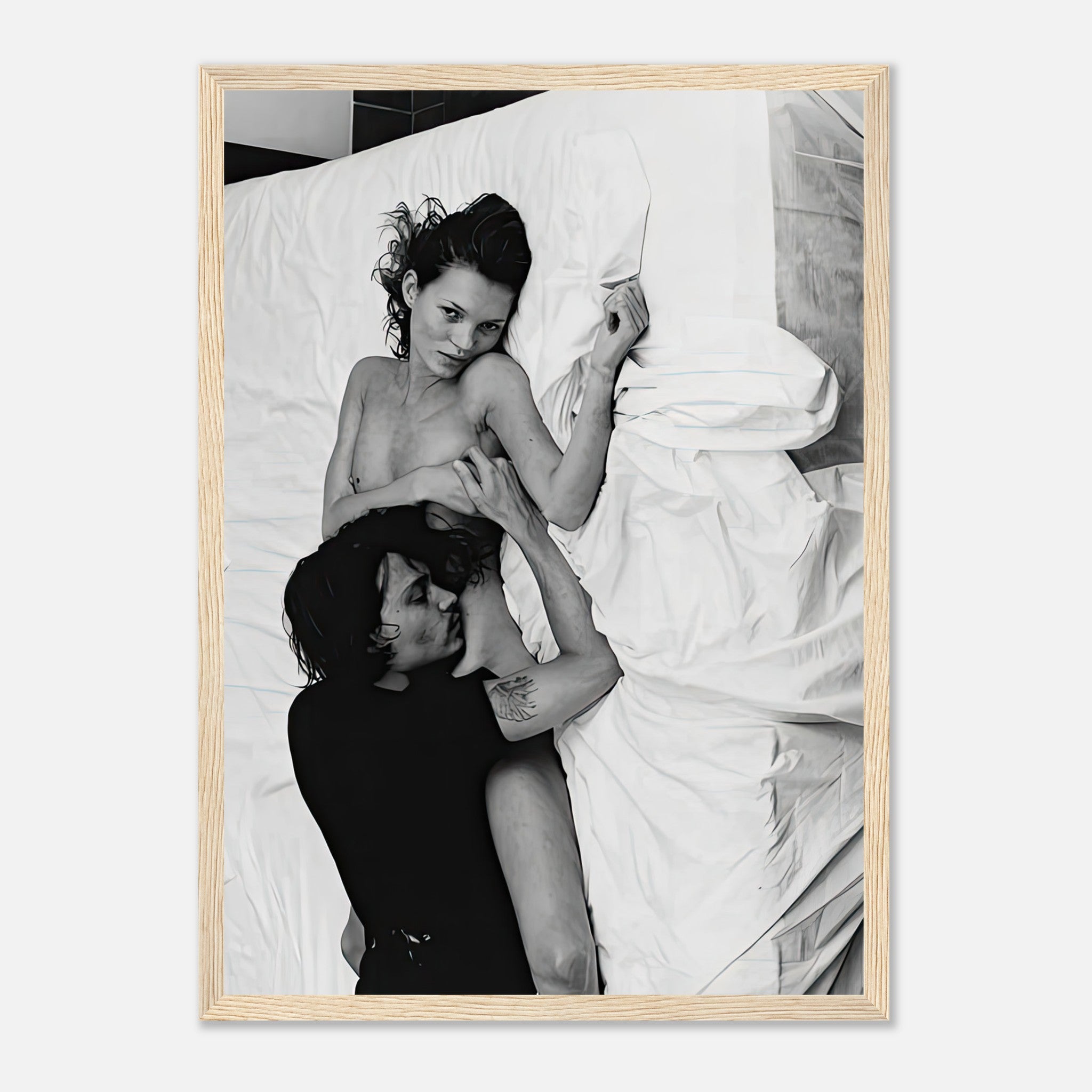 Framed print of Kate Moss and Johnny Depp in a passionate embrace, iconic black-and-white photo, New York 1994.