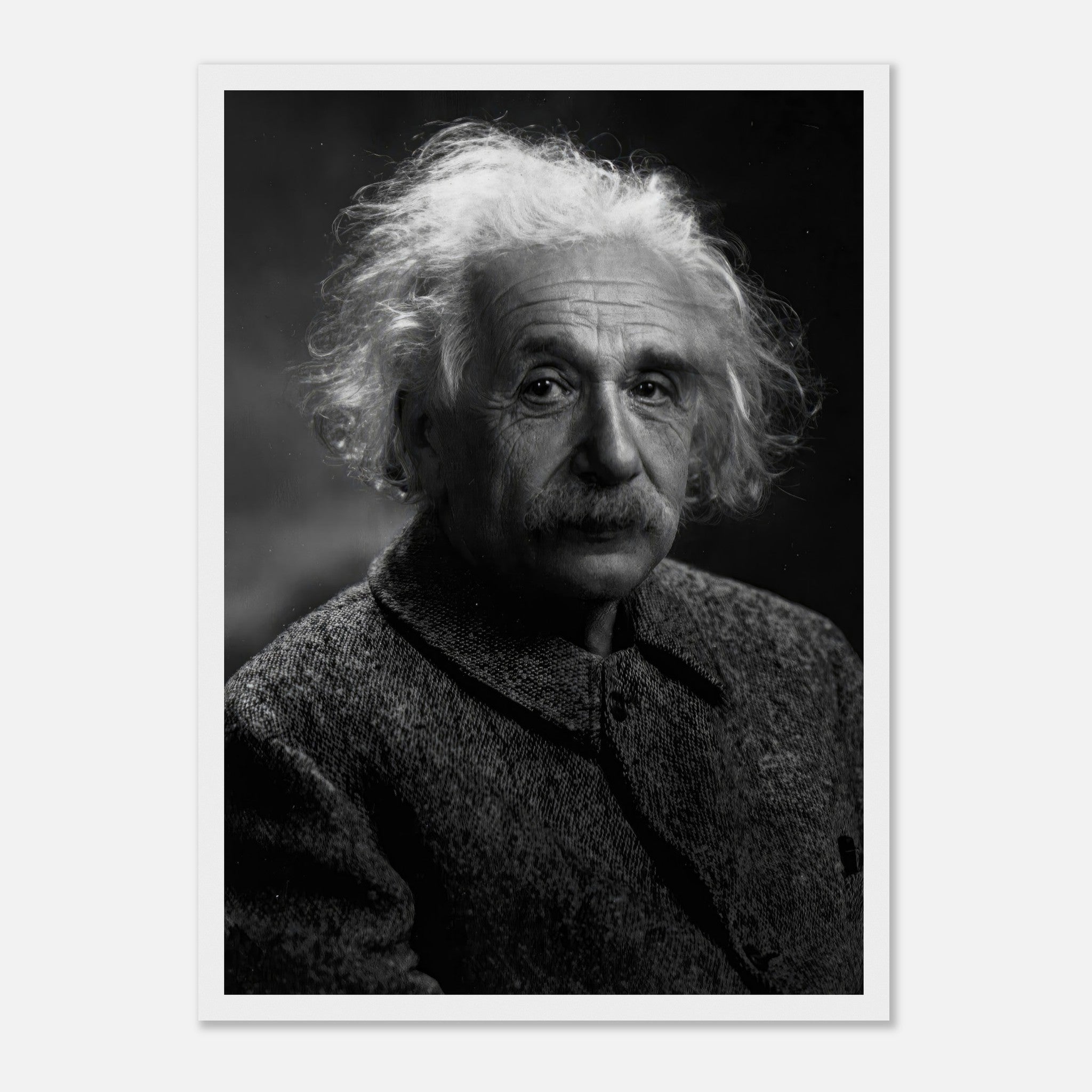Black-and-white portrait of Albert Einstein in a framed print, showcasing his thoughtful expression and iconic hairstyle.