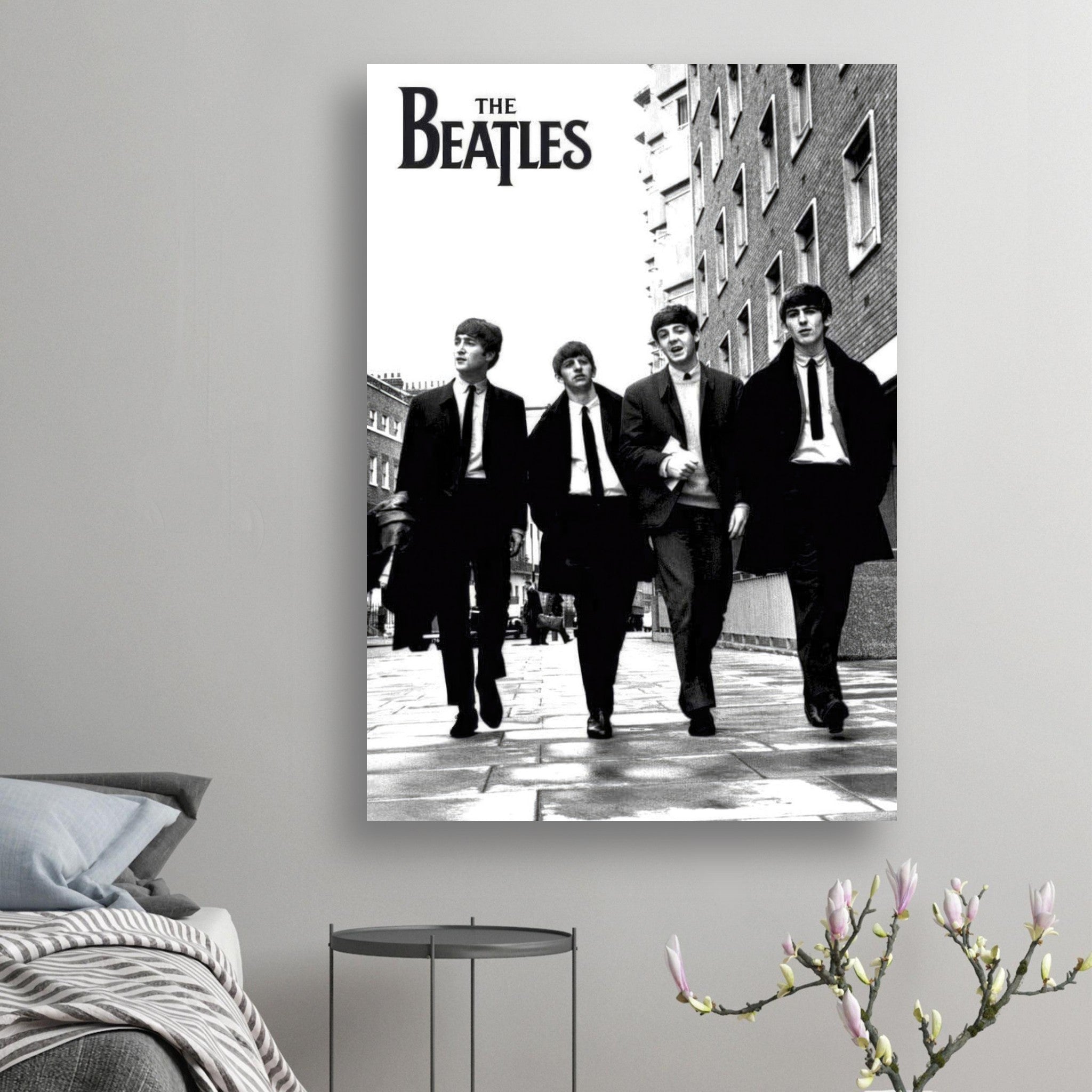 The Beatles cover poster featuring the iconic band walking in a black and white urban setting.