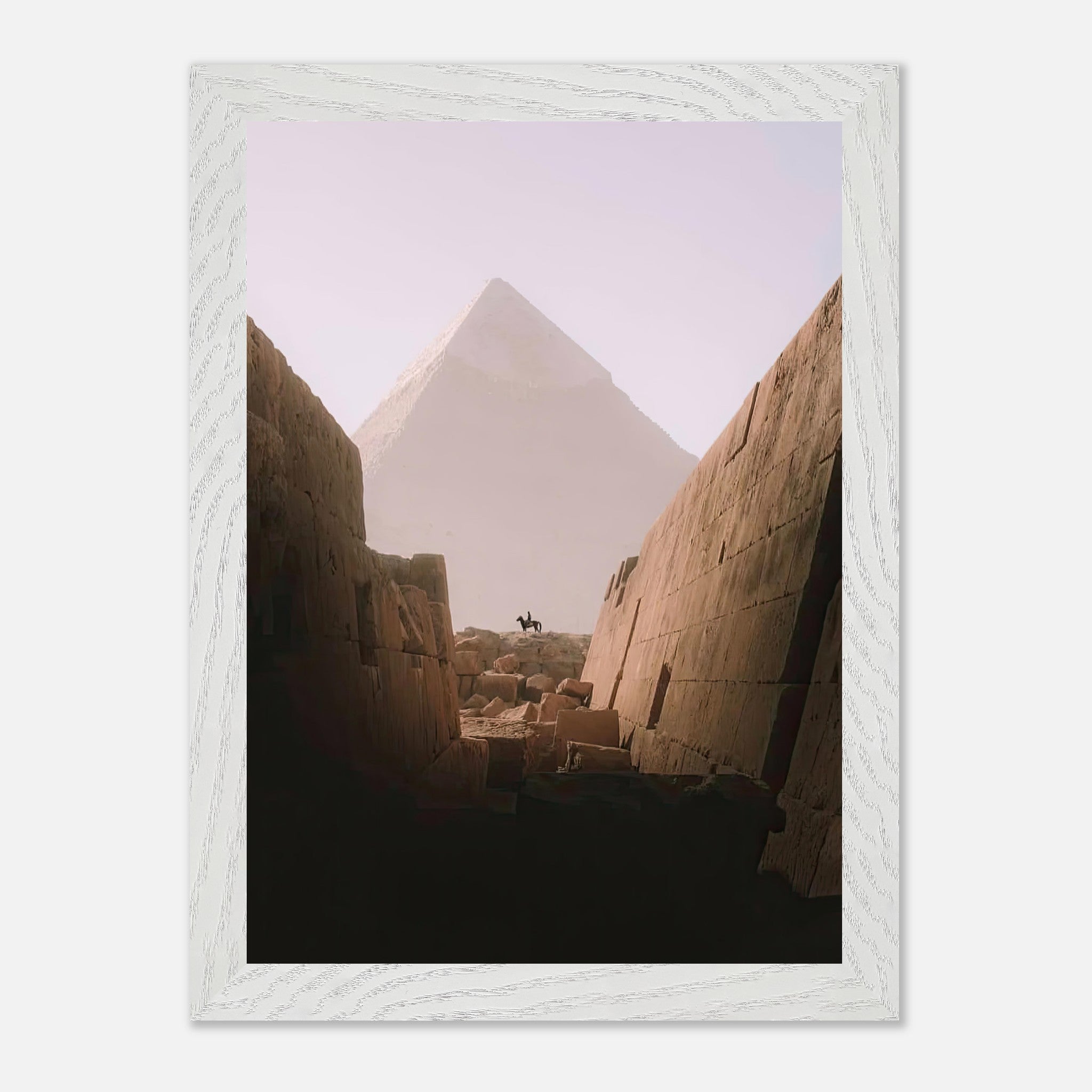 Vintage print of a rider on horseback with the Great Pyramid of Giza in the background, evoking adventure and history.