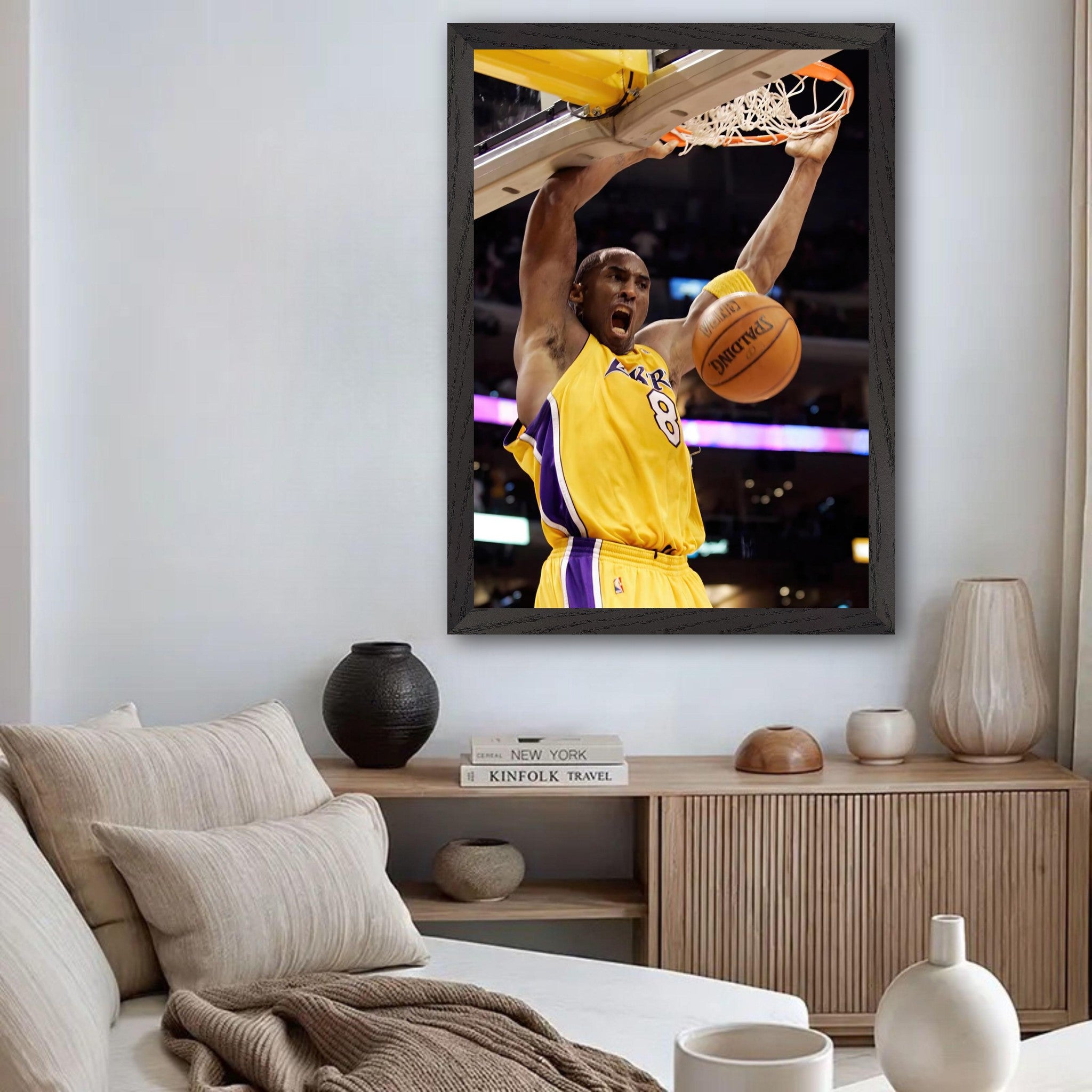 Kobe Bryant's iconic slam dunk vintage framed print displayed in a modern living room setting.