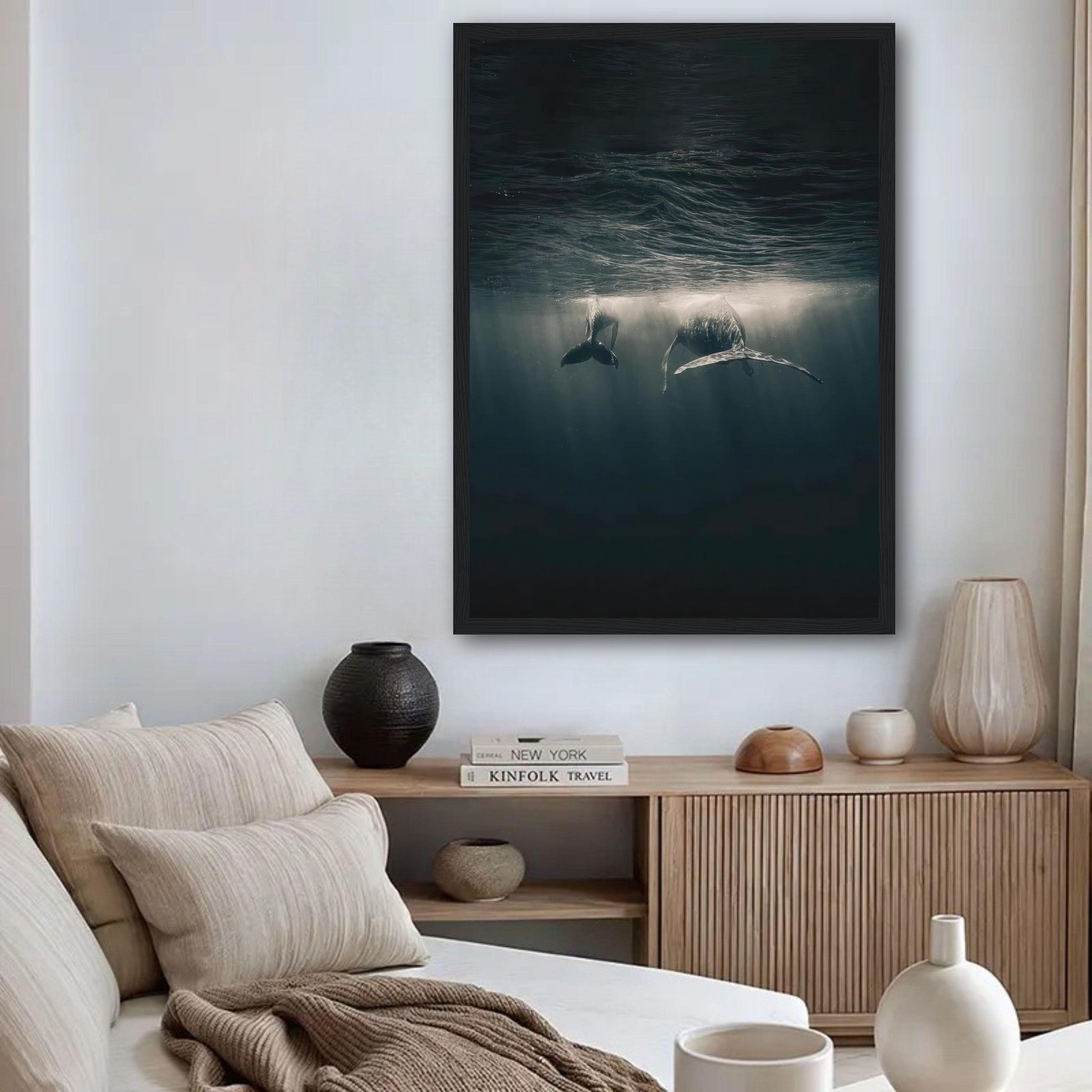 Framed print of whales underwater, showcasing serene ocean beauty and soft sunlight rays filtering through the water.