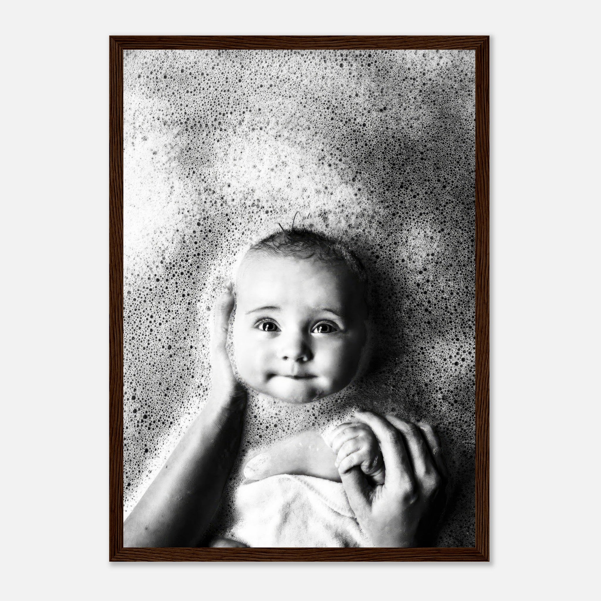 Framed print of a joyful baby surrounded by bubbles during bath time, showcasing innocence and warmth.