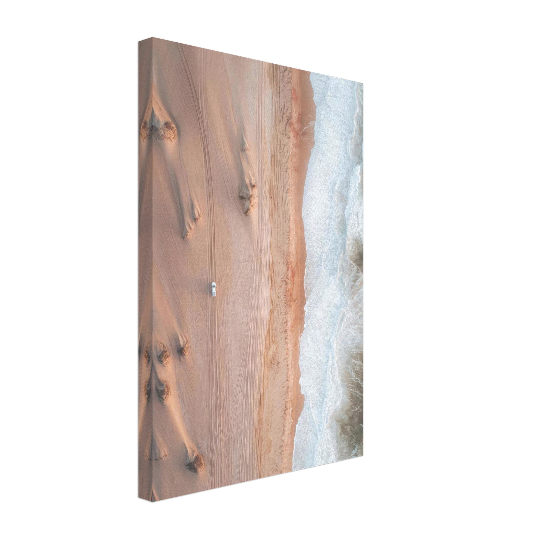 Aerial view of sand dunes meeting ocean waves in a stunning canvas print.