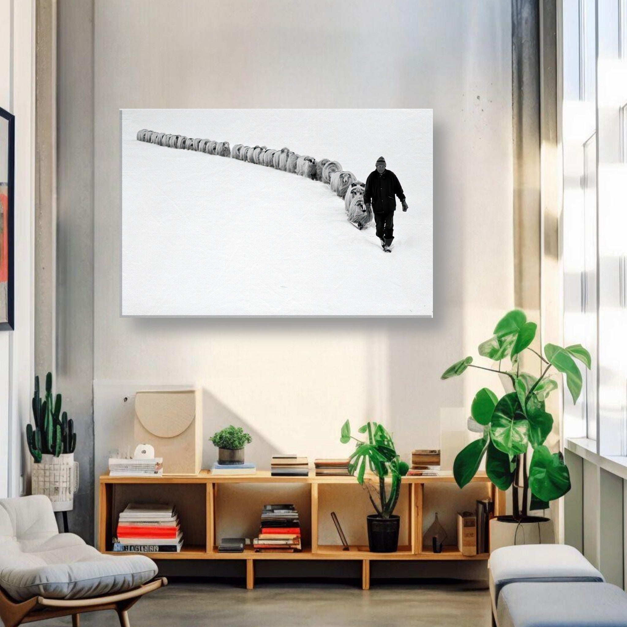 Black-and-white canvas print of shepherd walking with flock in a snowy landscape, enhancing rural decor.
