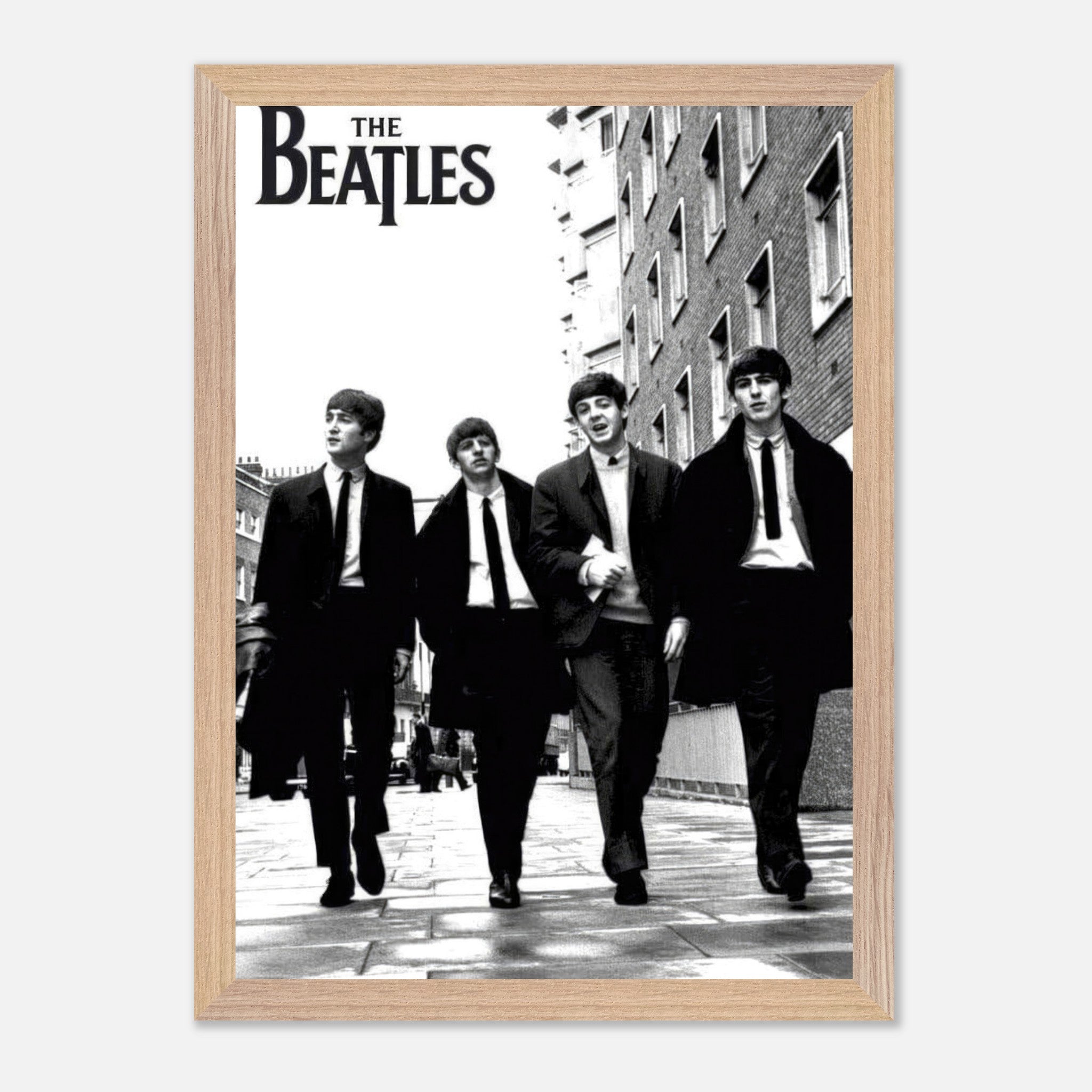The Beatles vintage framed print featuring the iconic band walking together in black and white.